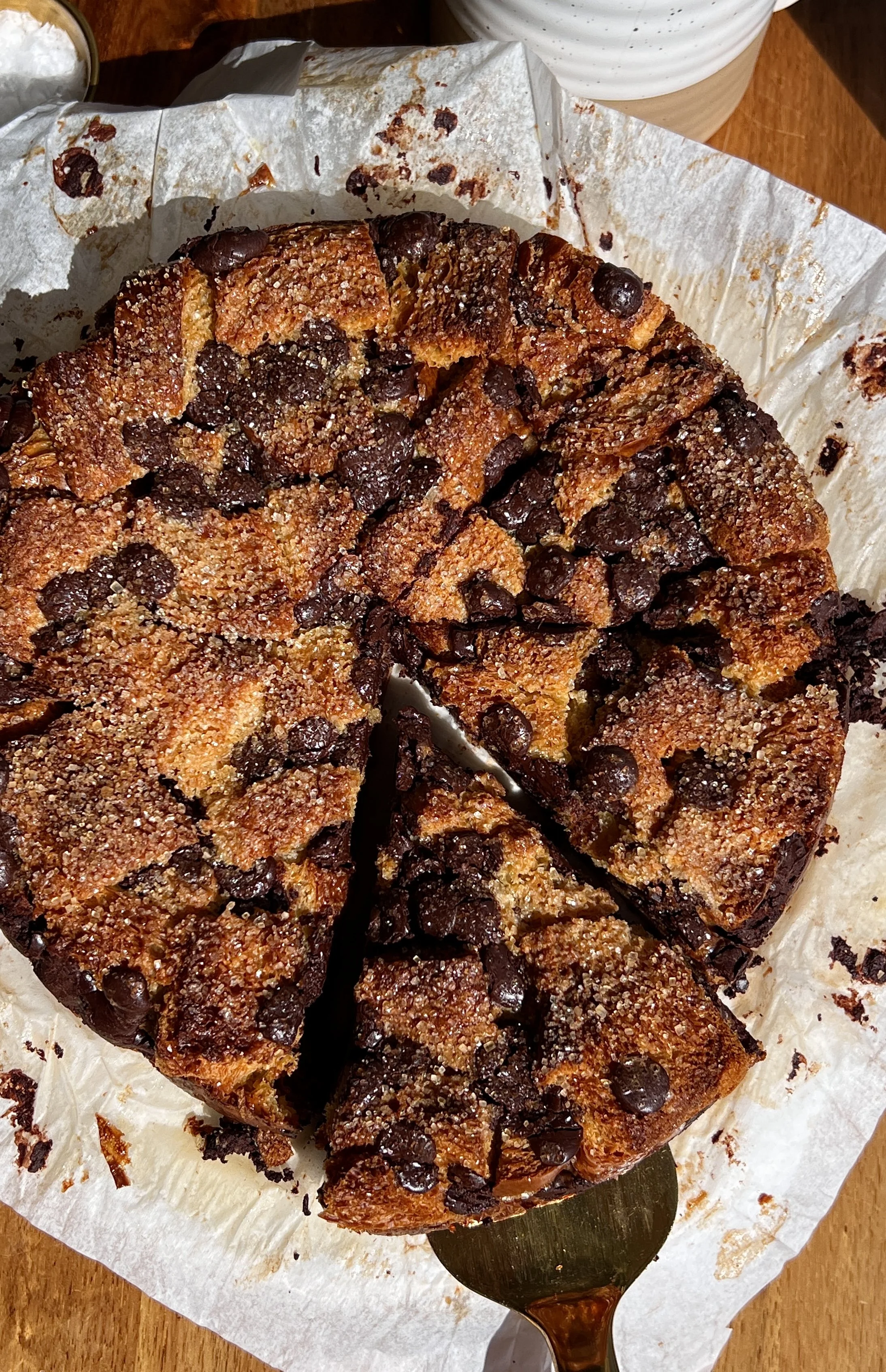 Chocolate chip bread pudding served warm with butter rum sauce, vanilla ice cream, and flaky sea salt.