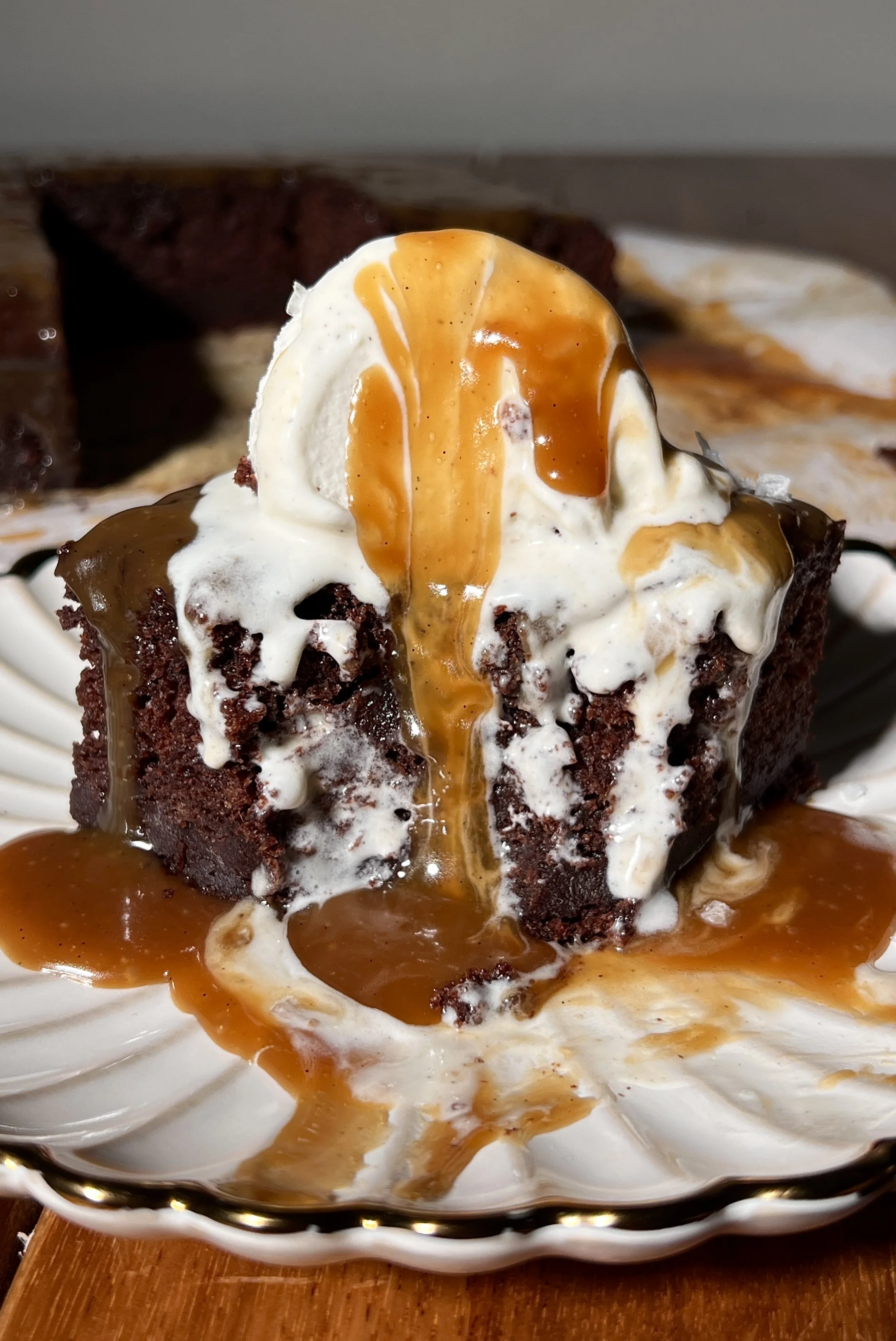 Close-up of chocolate espresso sticky toffee pudding showing the moist cake texture and silky toffee sauce.