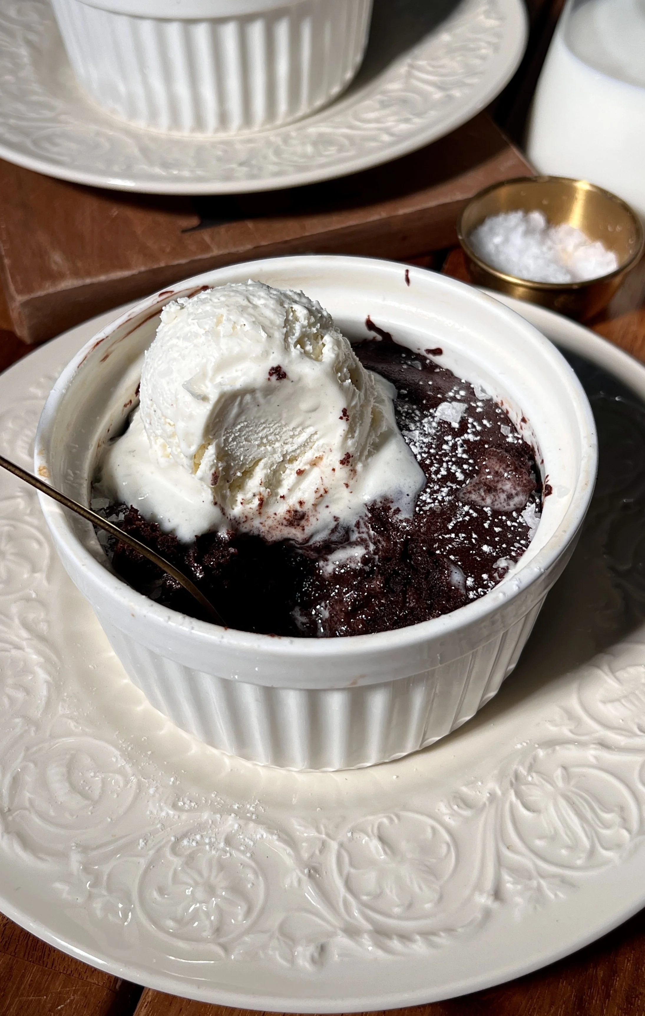 Soft and fudgy flourless chocolate cake with a crisp crackly top and rich chocolate center.