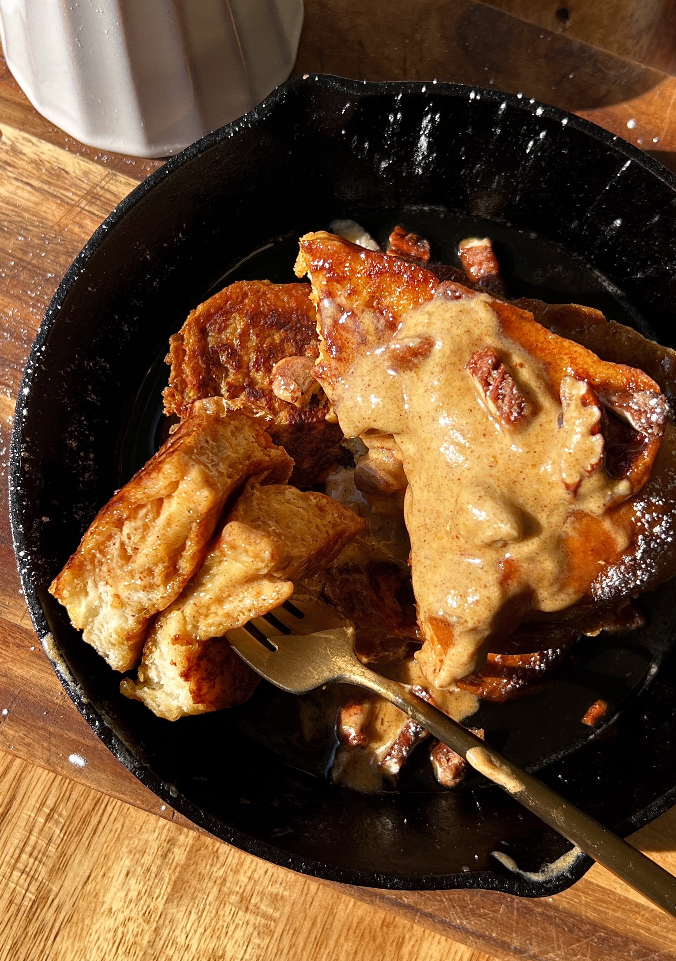 Thick cut pumpkin spice french toast with a perfectly golden exterior and soft custardy center served warm with whipped pumpkin mascarpone, powdered sugar, and maple syrup as the ultimate cozy fall breakfast.