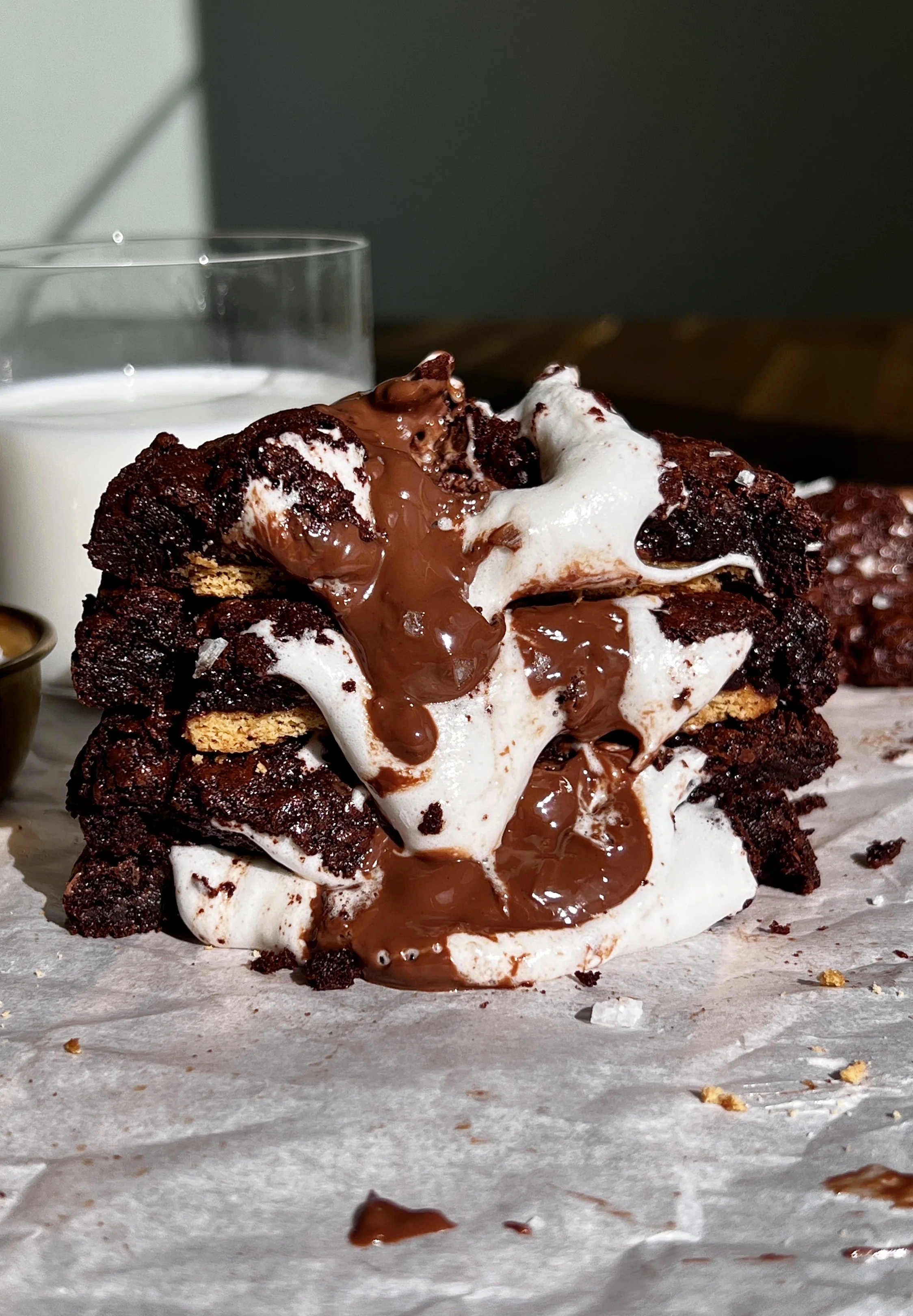 Fudgy s’mores brownie cookies with crispy edges, gooey marshmallow, and melted milk chocolate.
