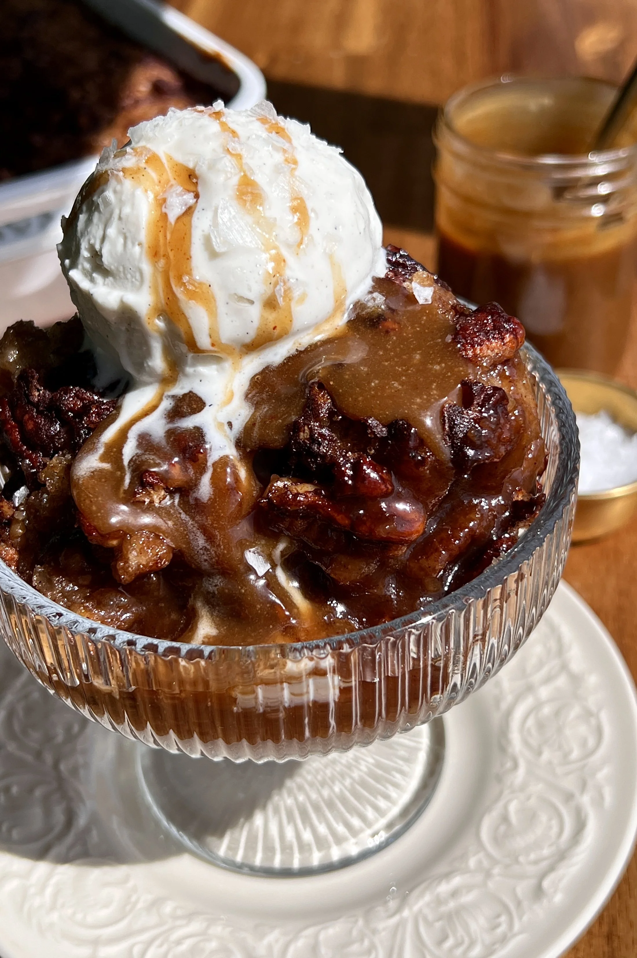 Close-up of self-saucing banana pudding cake with gooey syrupy bottom and soft golden cake top.