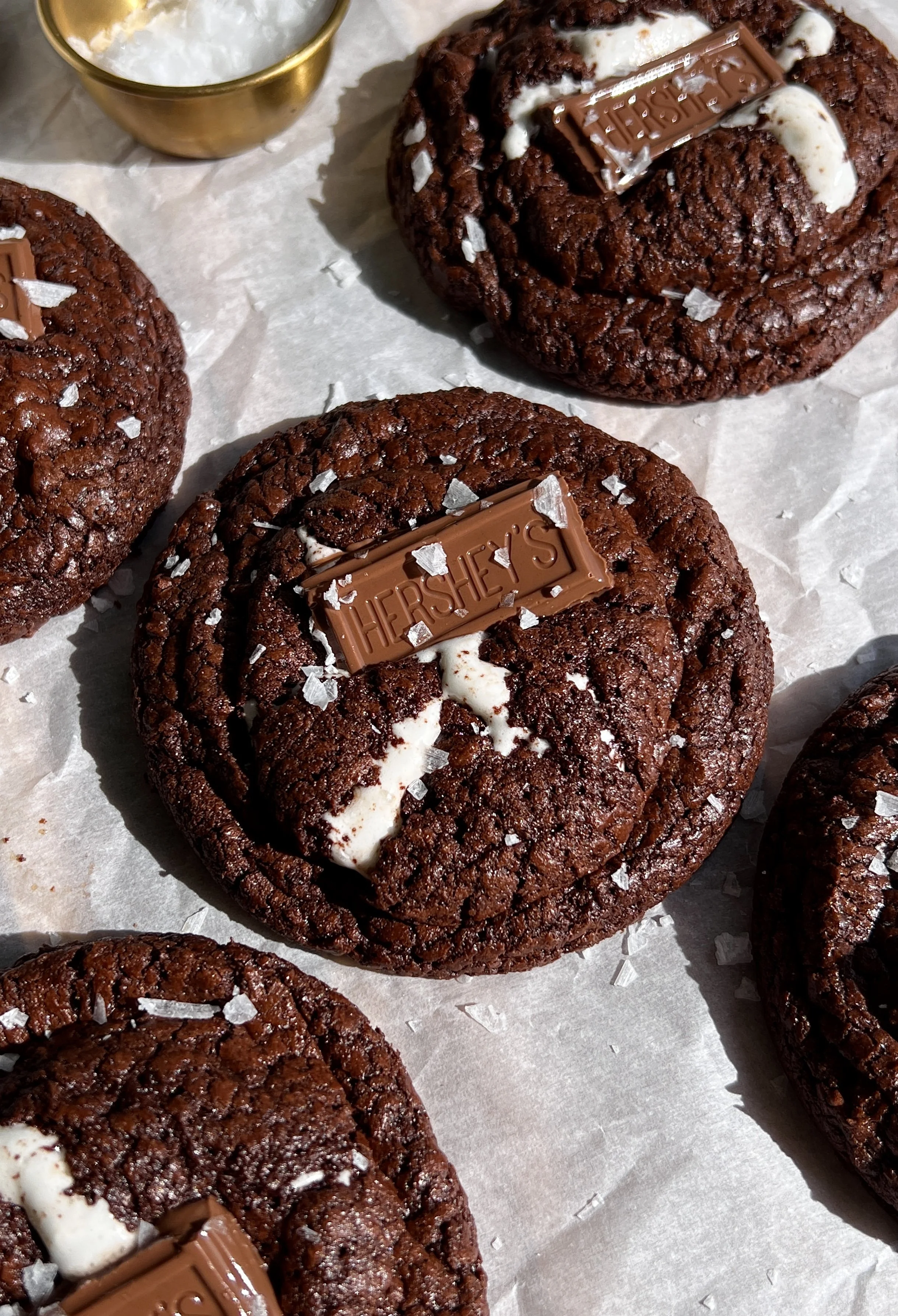 S’mores brownie cookies with crinkle tops, graham cracker bottoms, melty chocolate, and gooey marshmallow centers.