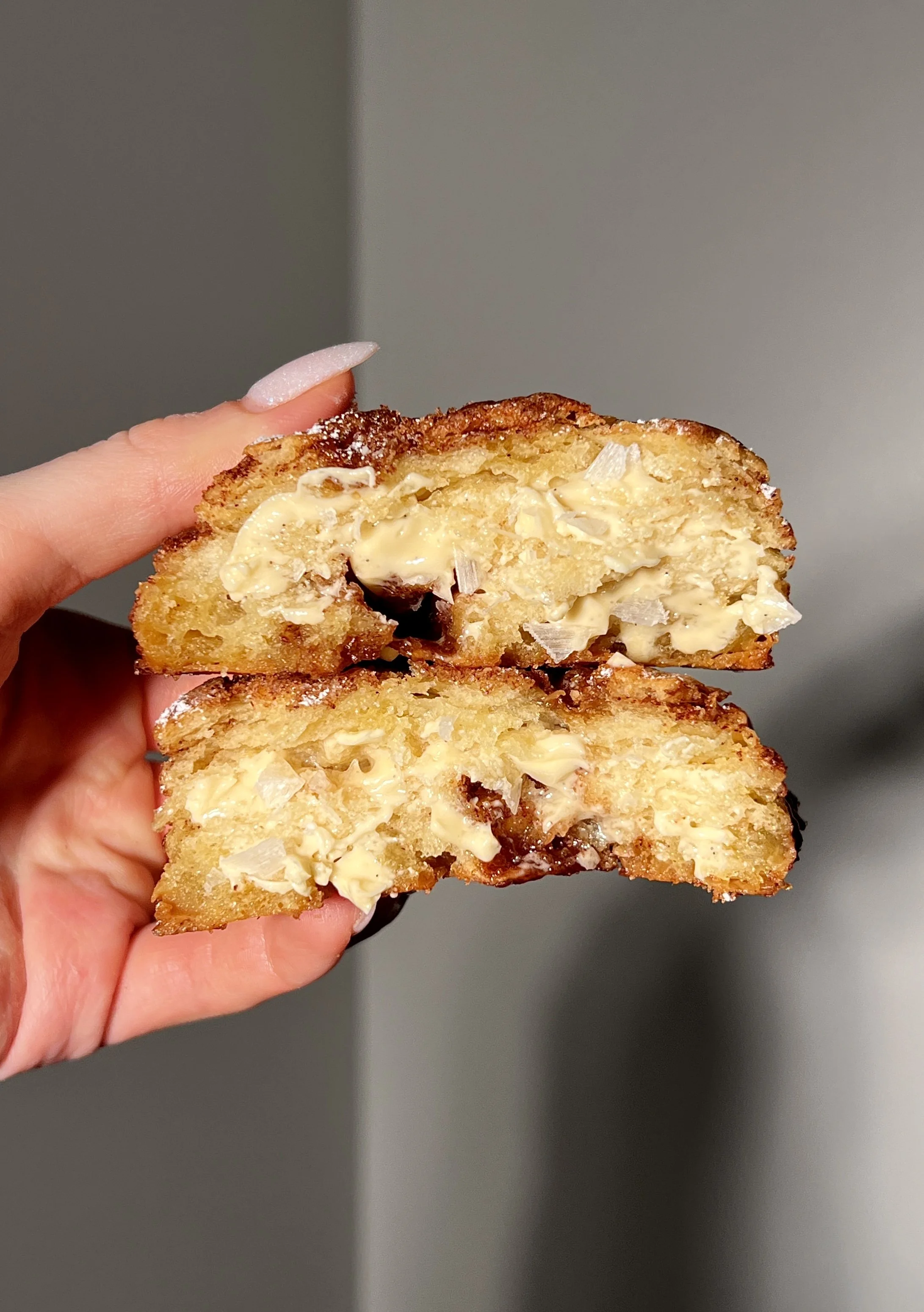 Close-up of flaky French toast biscuits showing buttery layers and cinnamon sugar swirls.
