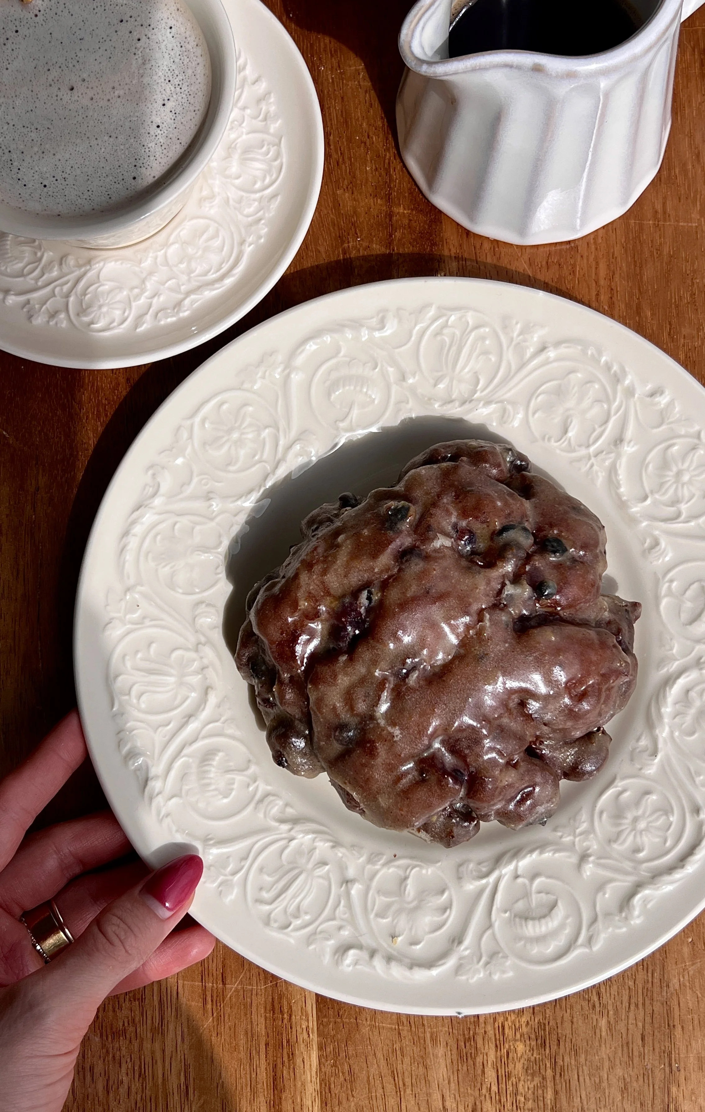 Soft and fluffy blueberry fritters fried until golden and coated in a silky brown butter lemon glaze served warm with a hot cup of coffee.