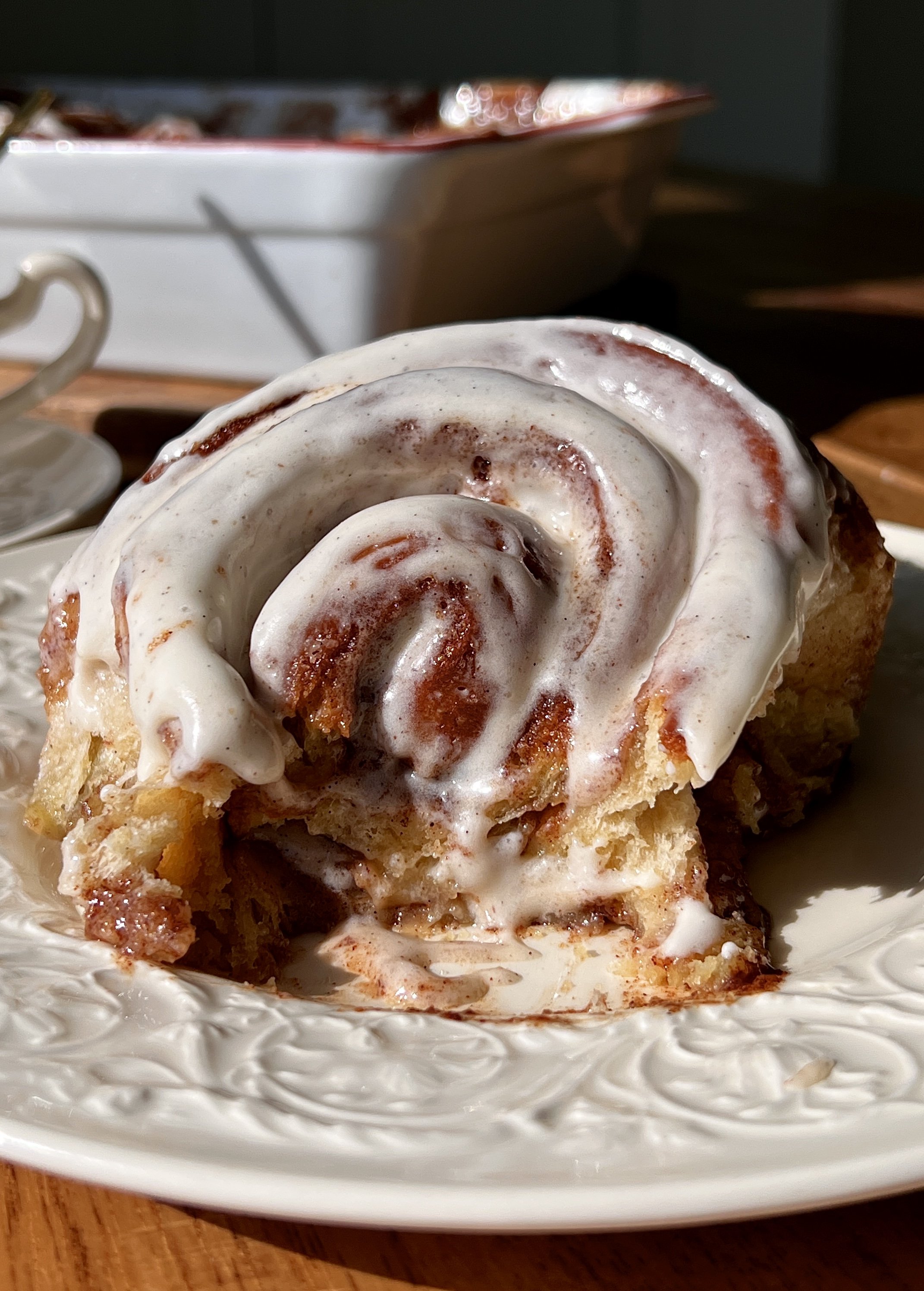 Perfect classic cinnamon rolls that are big, pillowy soft, and fluffy with a gooey cinnamon filling, topped with cream cheese frosting and served warm with coffee.