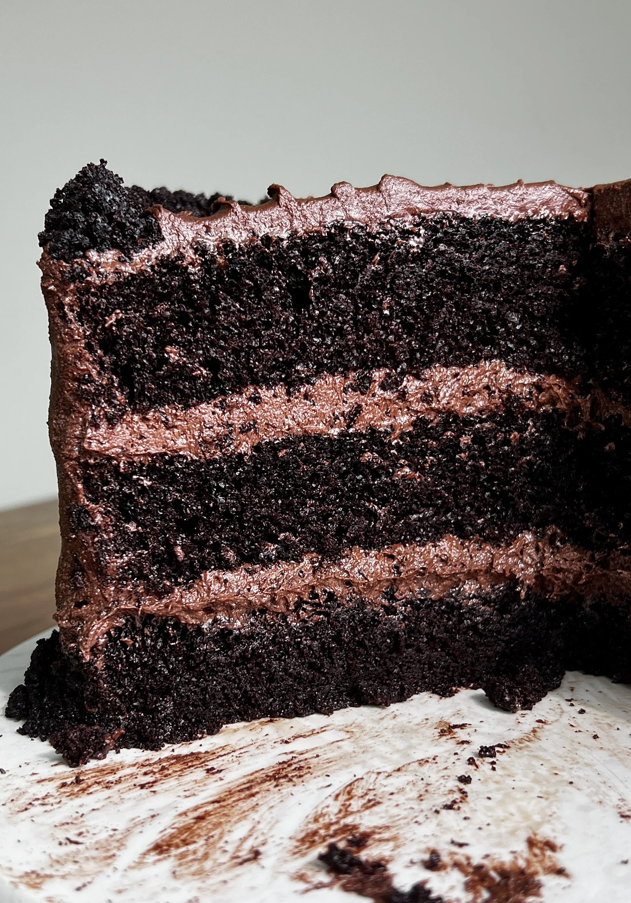 Classic chocolate layer cake served with smooth chocolate frosting and rich chocolate layers.