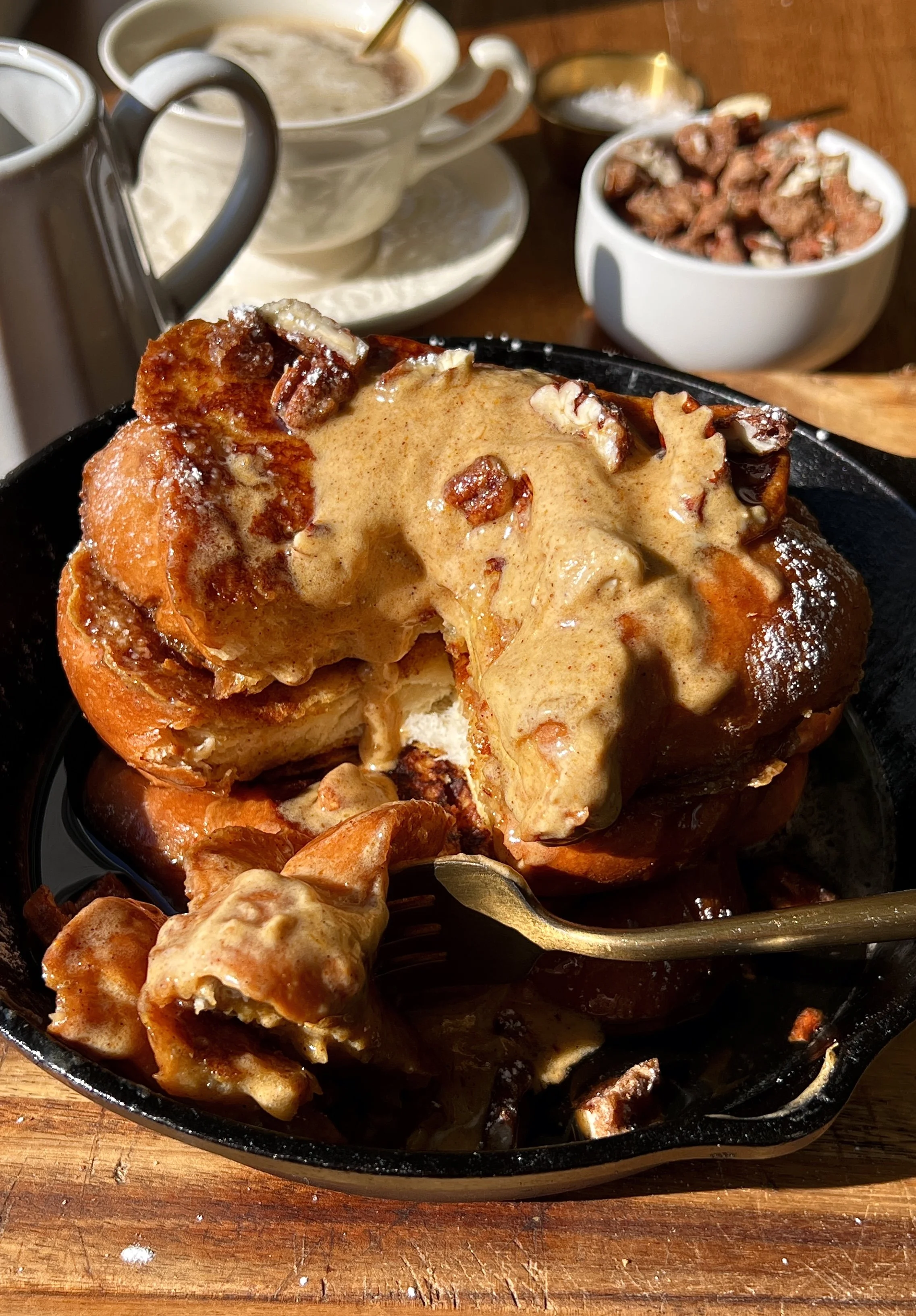 Thick cut pumpkin spice french toast with a perfectly golden exterior and soft custardy center served warm with whipped pumpkin mascarpone, powdered sugar, and maple syrup as the ultimate cozy fall breakfast.
