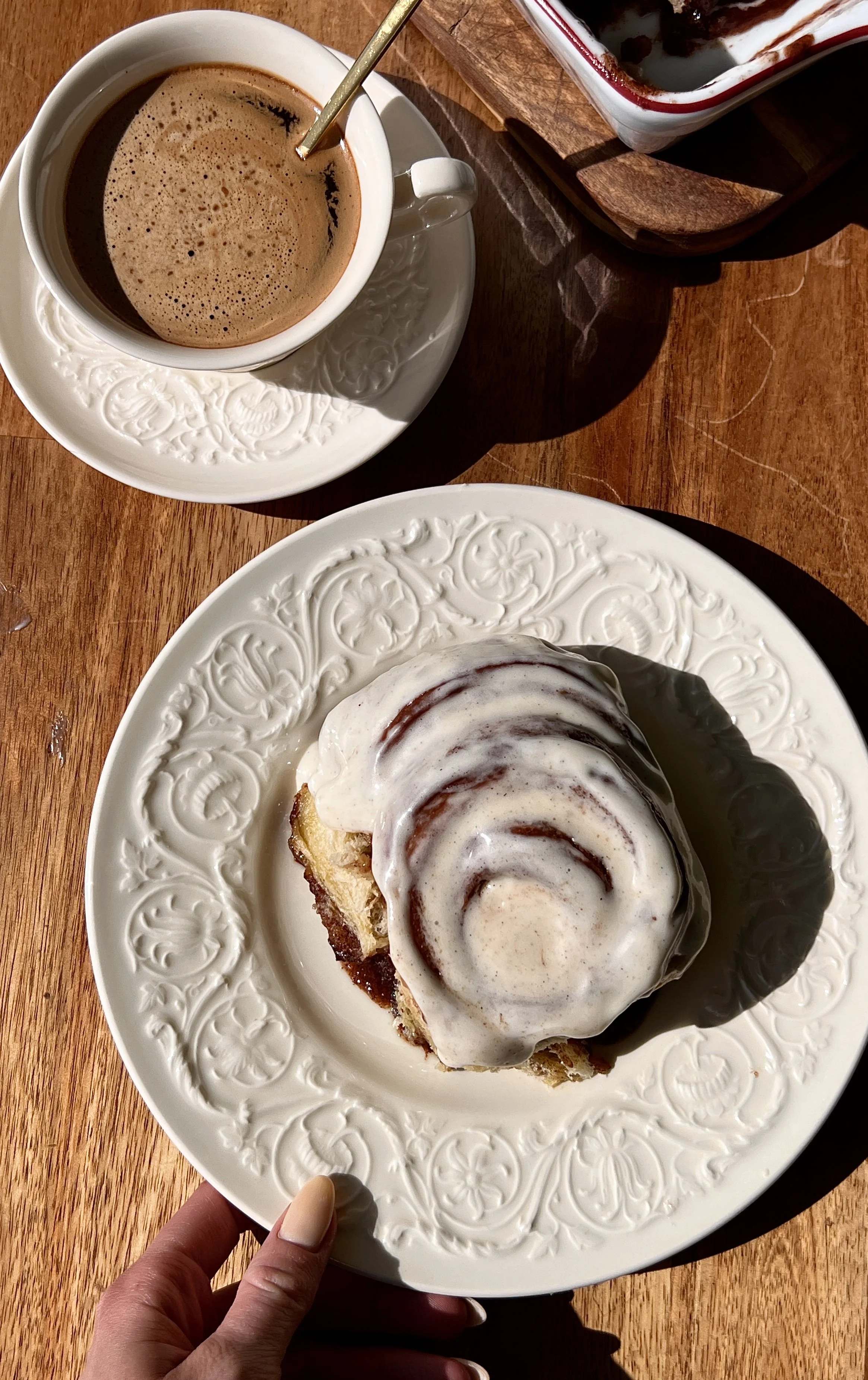 Perfect classic cinnamon rolls that are big, pillowy soft, and fluffy with a gooey cinnamon filling, topped with cream cheese frosting and served warm with coffee.