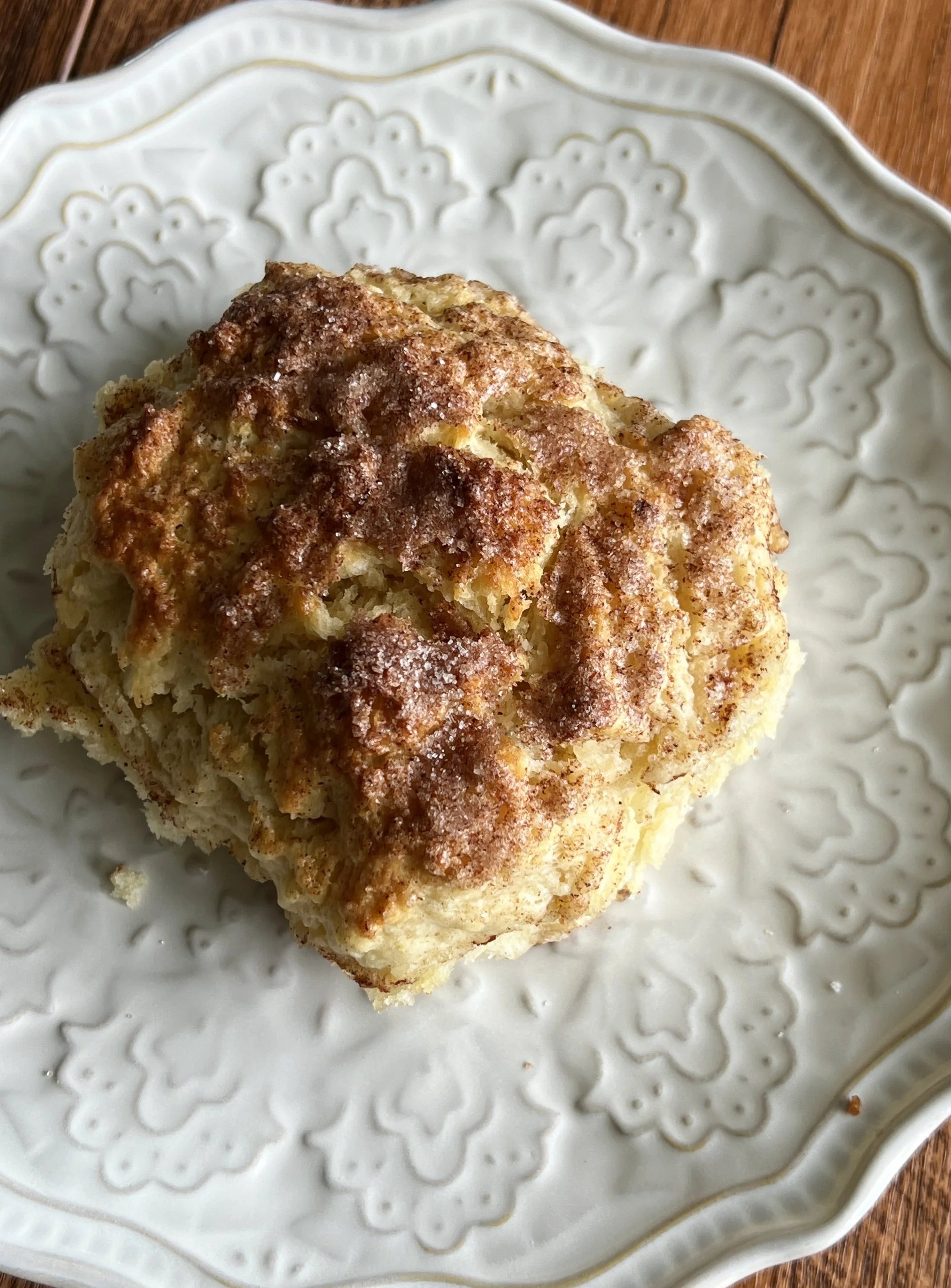Fluffy, flaky, and buttery cinnamon crunch sourdough cathead biscuits made with sourdough discard, topped with crunchy cinnamon sugar, served with butter and flaky sea salt.