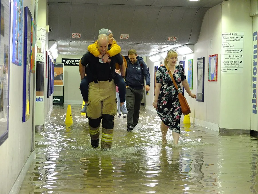 Stranded passengers being rescued by firemen-Oxford Mail