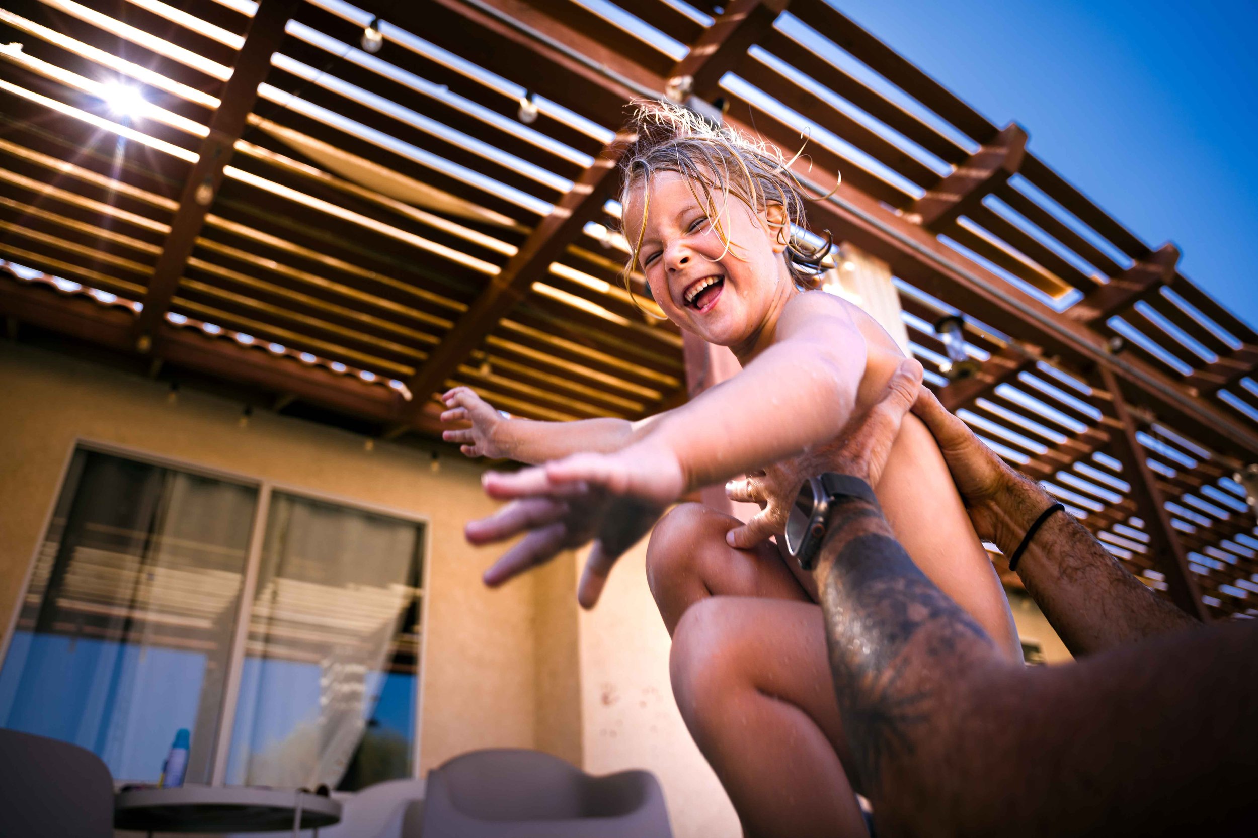Photo of a child playing in the pool in Palm Springs, CA.