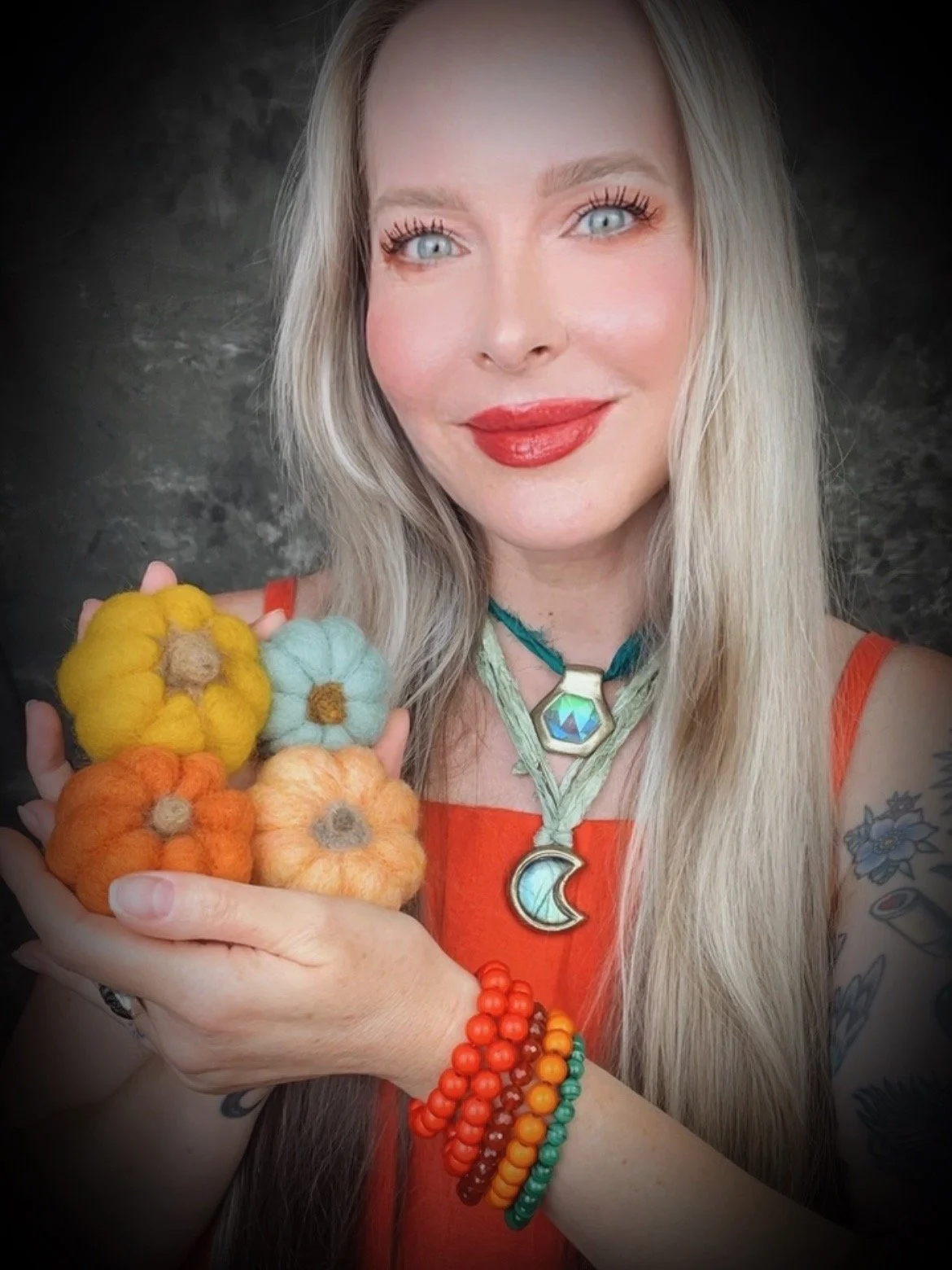 Kari full face holding little pumpkins.jpeg