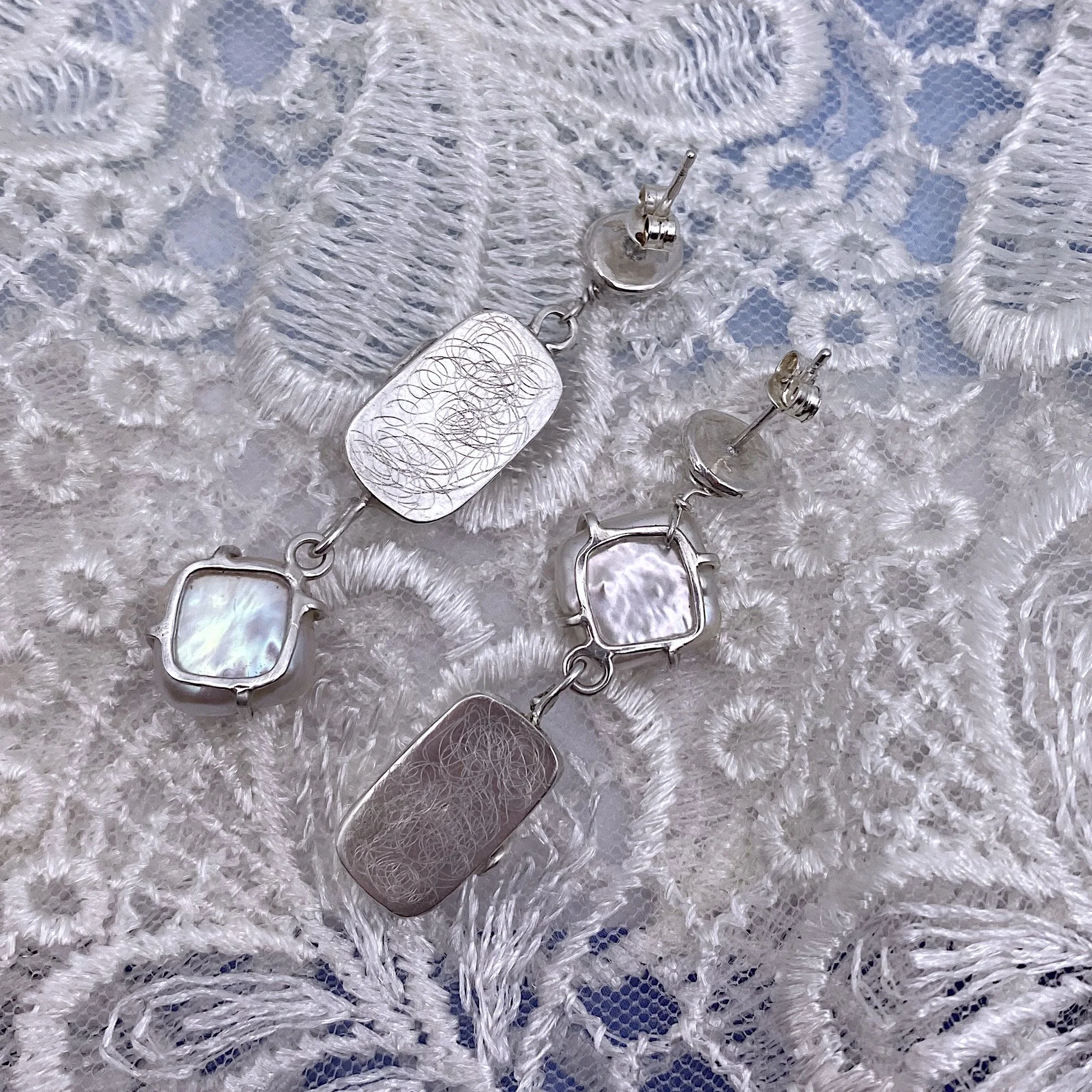 Mismatched statement pearl drop earrings back.jpg