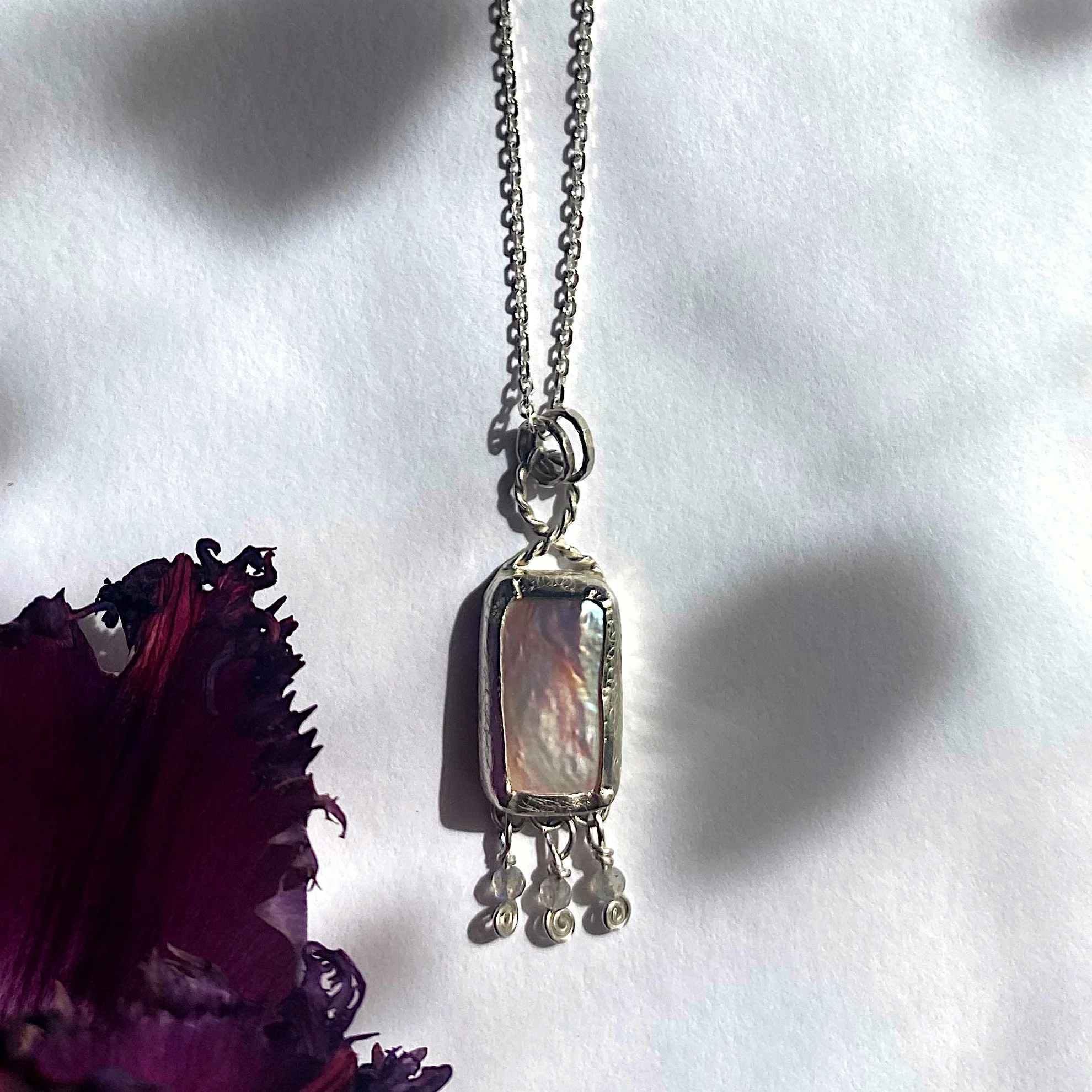 Mermaids purse pearl pendant with 3 labradorites white crop.jpeg
