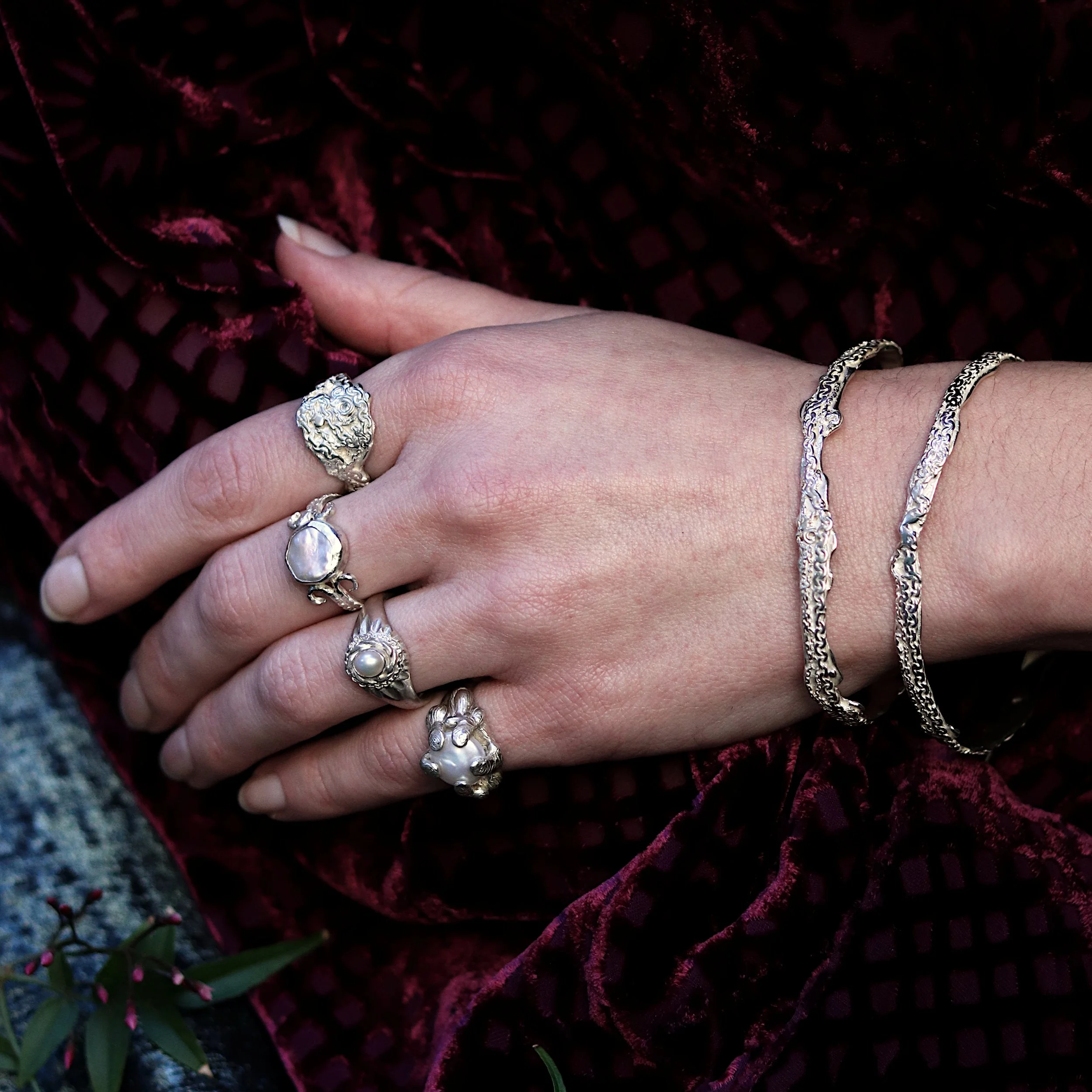 Silver rings and bangles on hand model crop.jpg