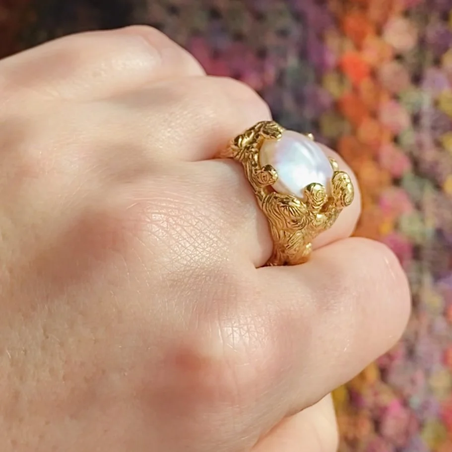 Gold Molten pearl claw ring on hand1.jpg