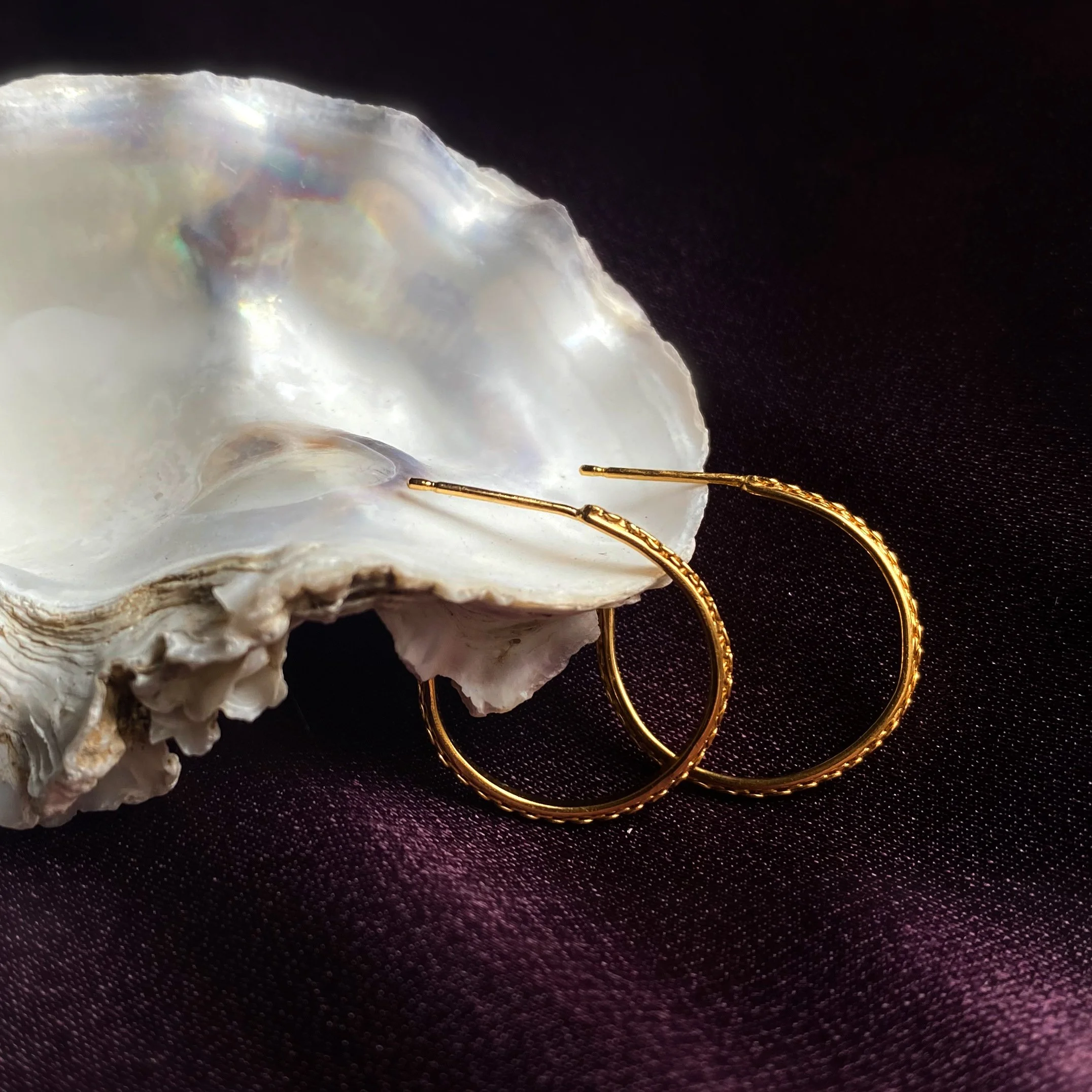 Gold plated chain hoops large on shell crop.jpg