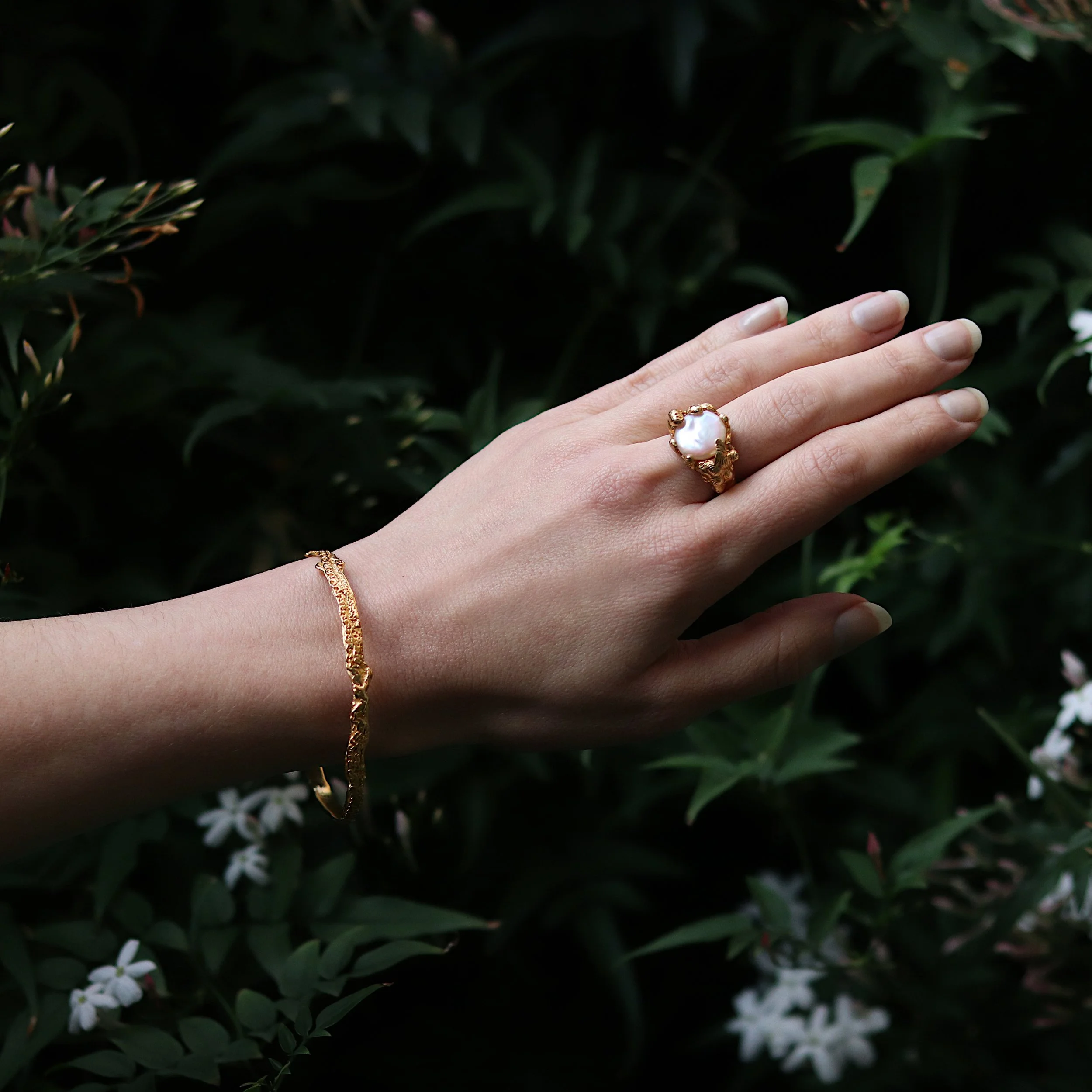 Gold molten pearl ring and bangle hand.jpg