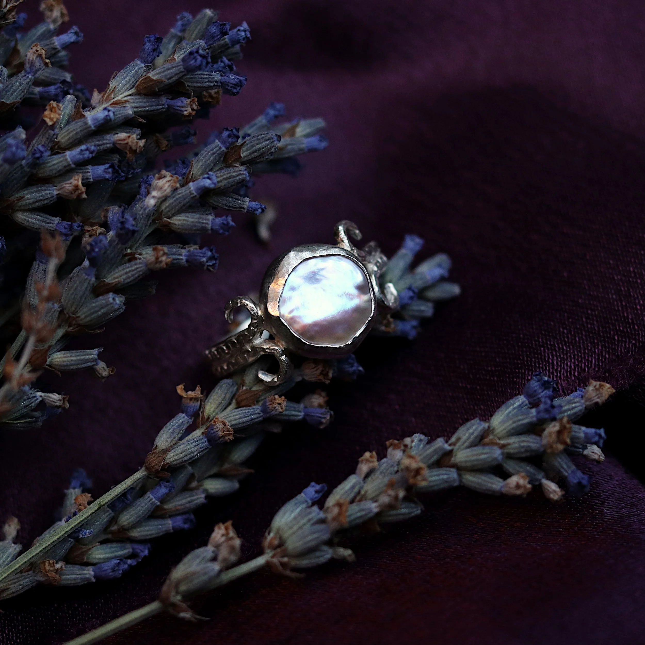 Irregular button pearl coiled silver ring with lavender.jpg