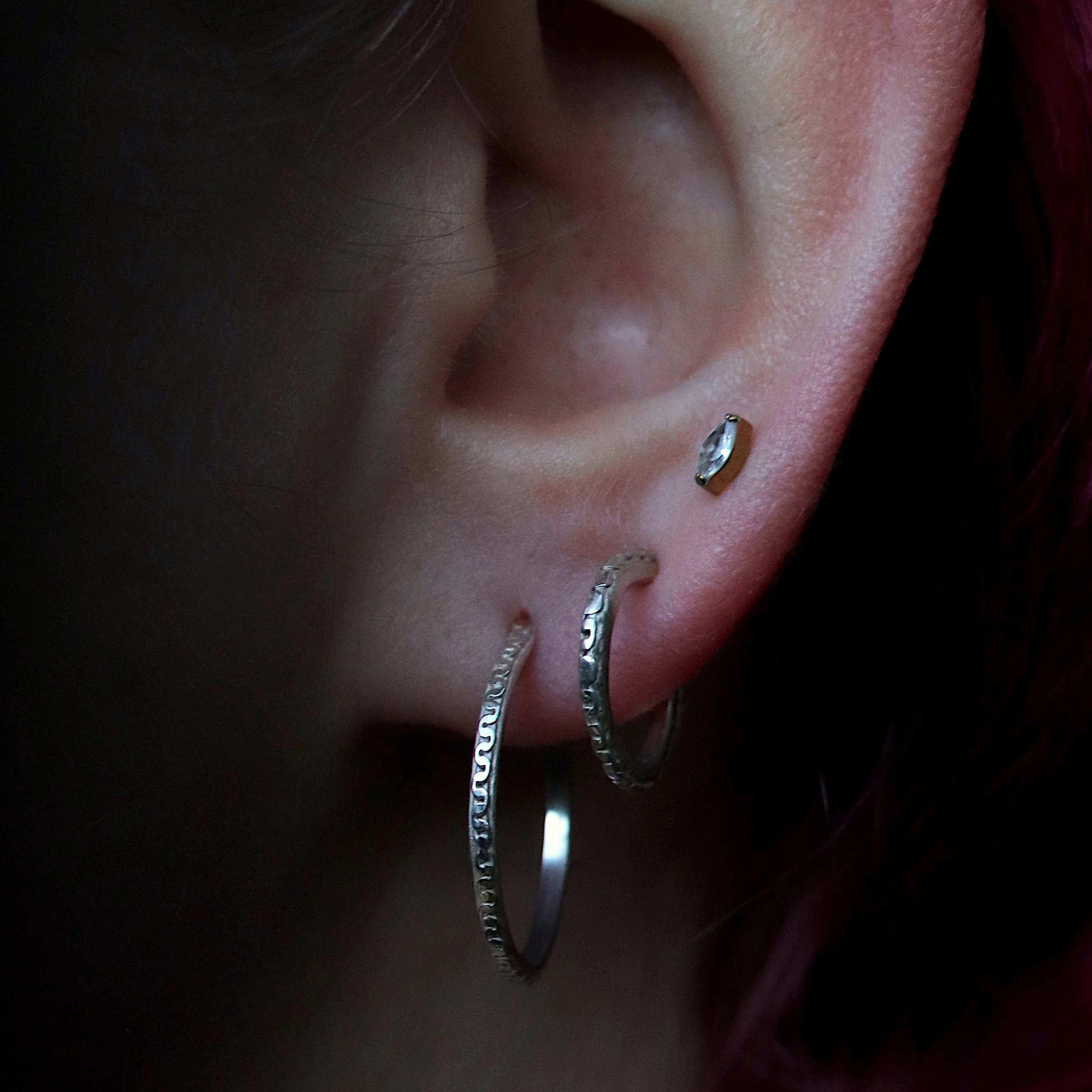 Silver chain hoops in ears crop.jpg
