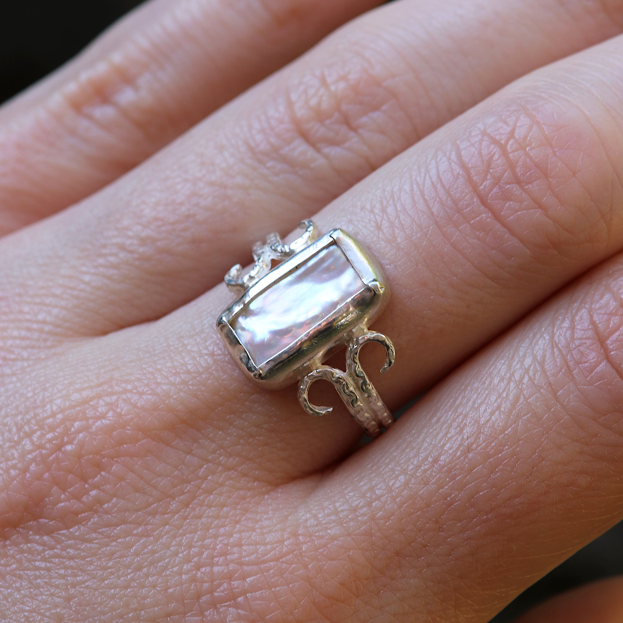 Rectangular Pearl Coiled Silver Ring on hand crop.jpg