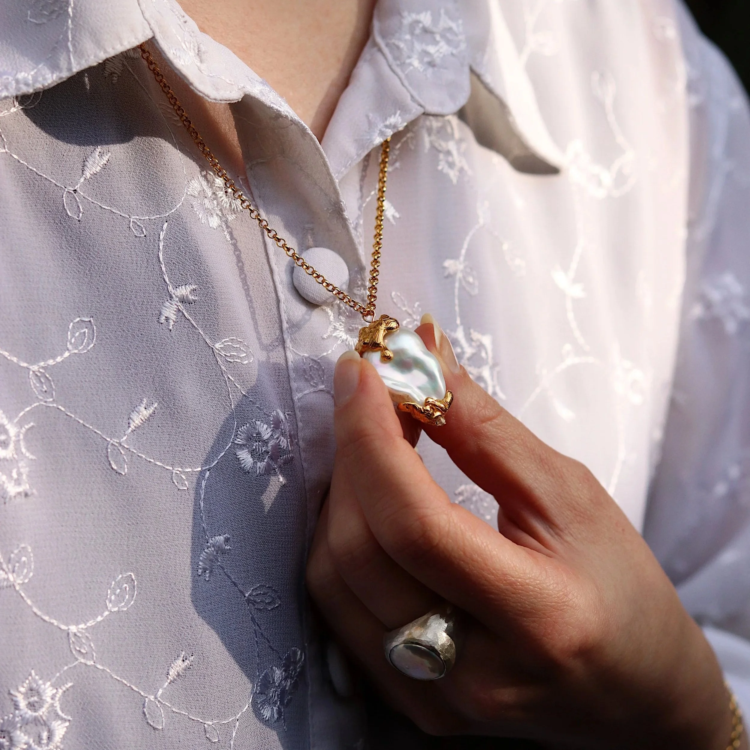 Large+Molten+Golden+Pearl+Necklace+model+and+ring.jpg