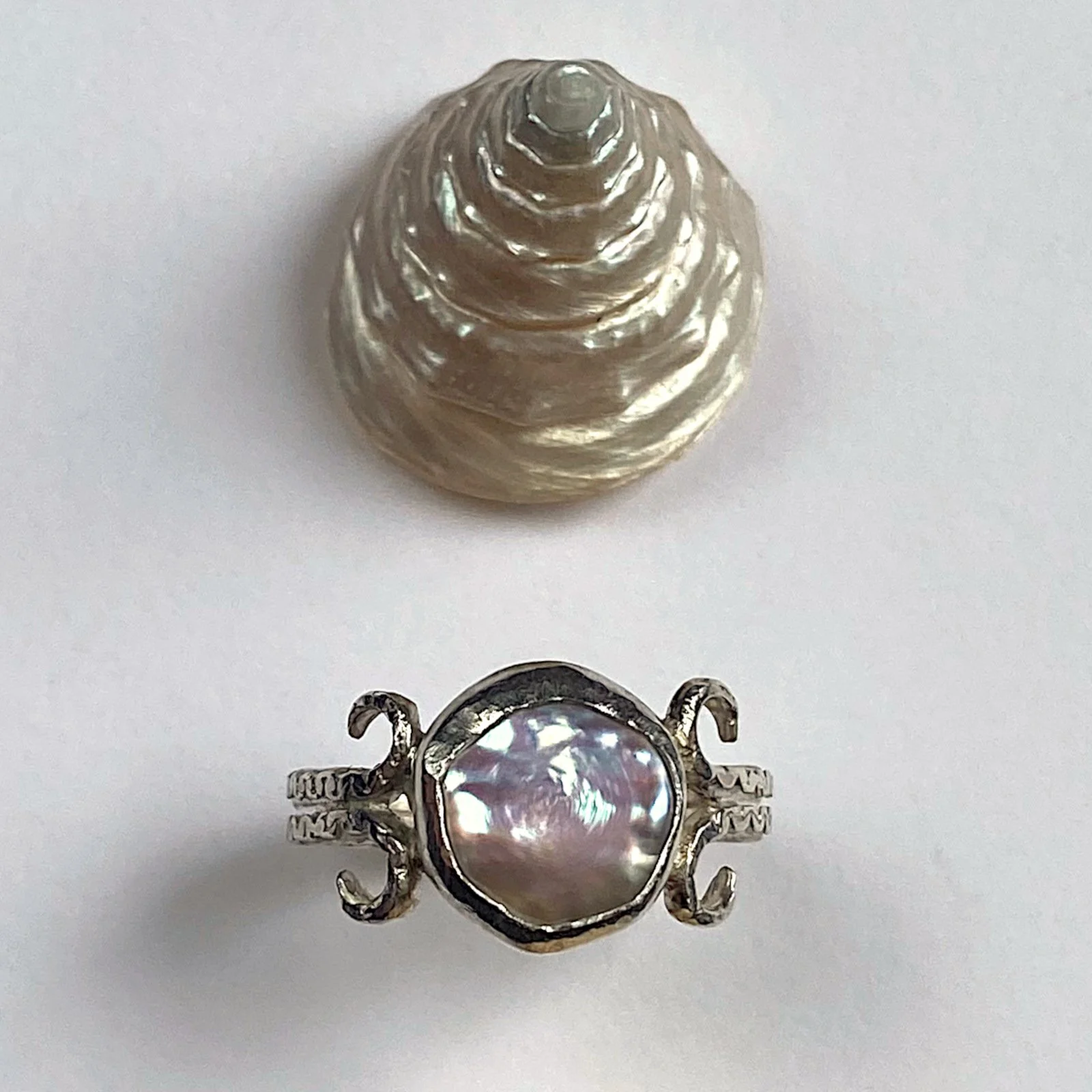 Irregular button pearl coiled silver ring with shells crop.jpg