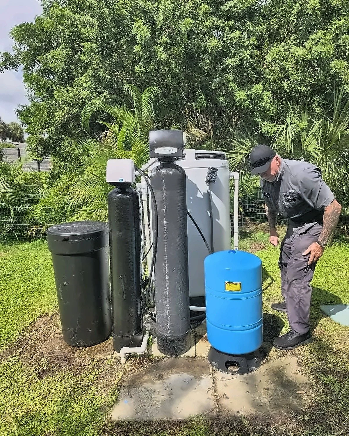 Dan servicing a well water softener and pressure tank