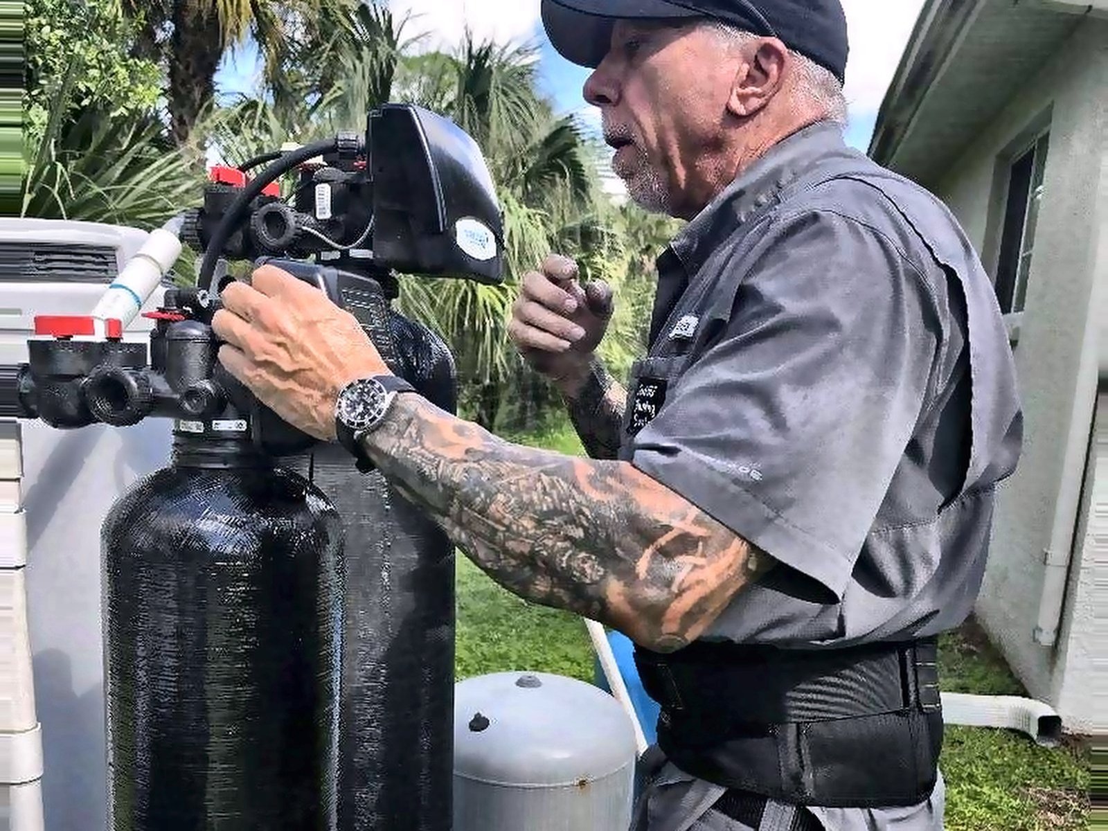 Master plumber Dan adjusting a well water softener and iron filter in Lee County, FL