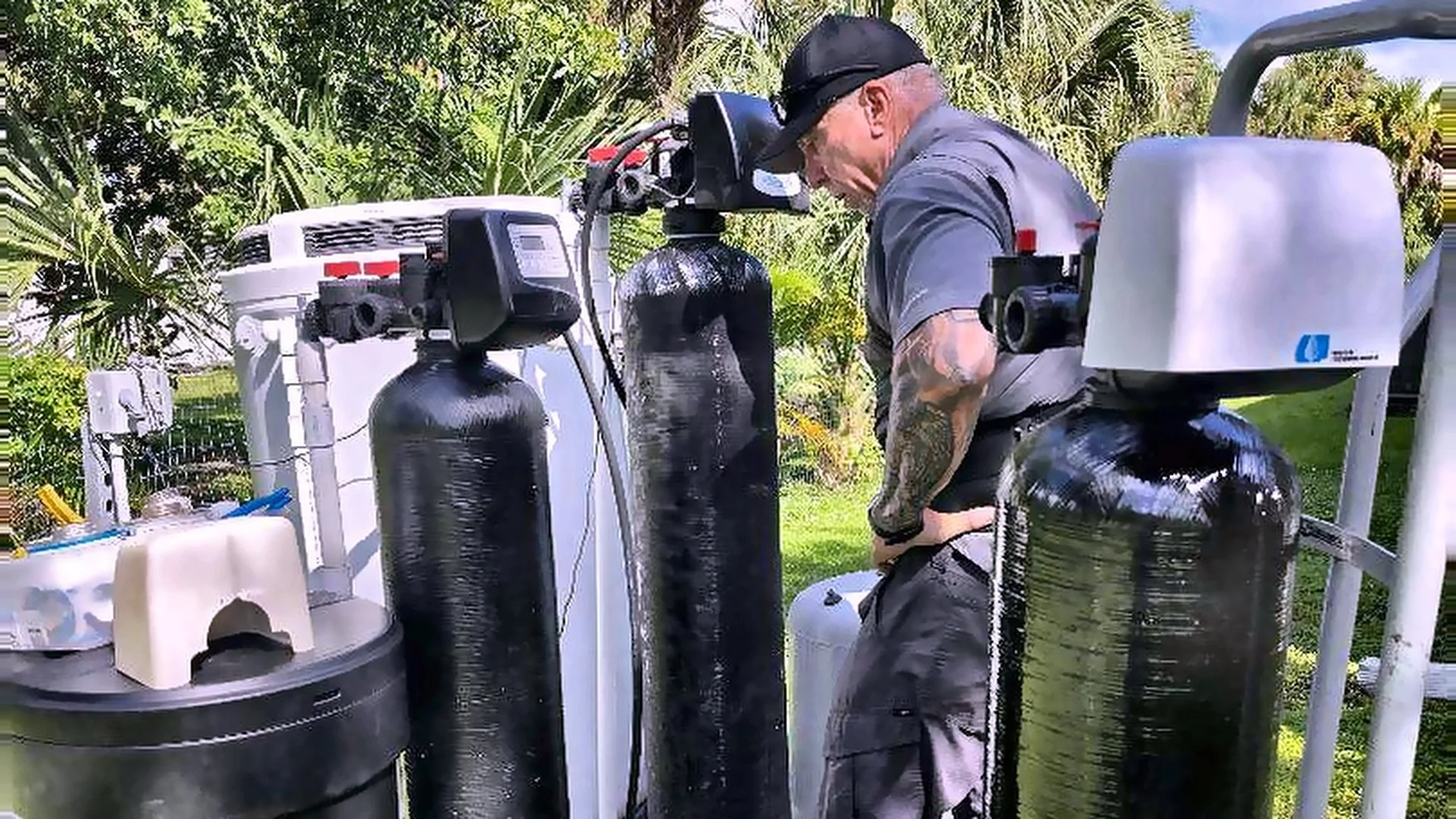 Good Ole Plumbing master plumber working on a well water treatment system in Southwest Florida