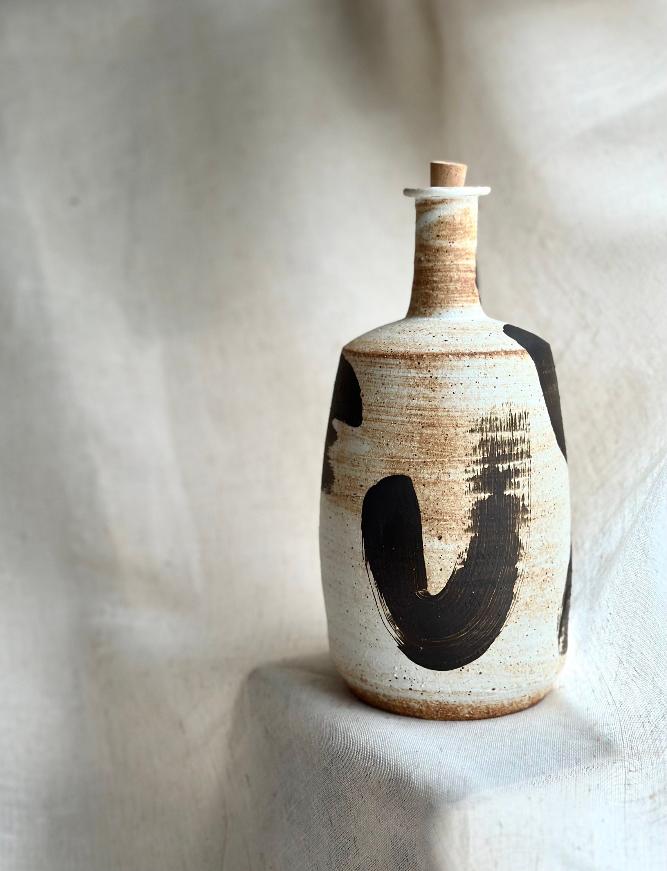 handcrafted home accent, timeless organic design, natural texture decor, handmade ceramic vase, neutral-toned pottery, sculptural home decor, designer ceramic art, ceramic wabi-sabi bottle
