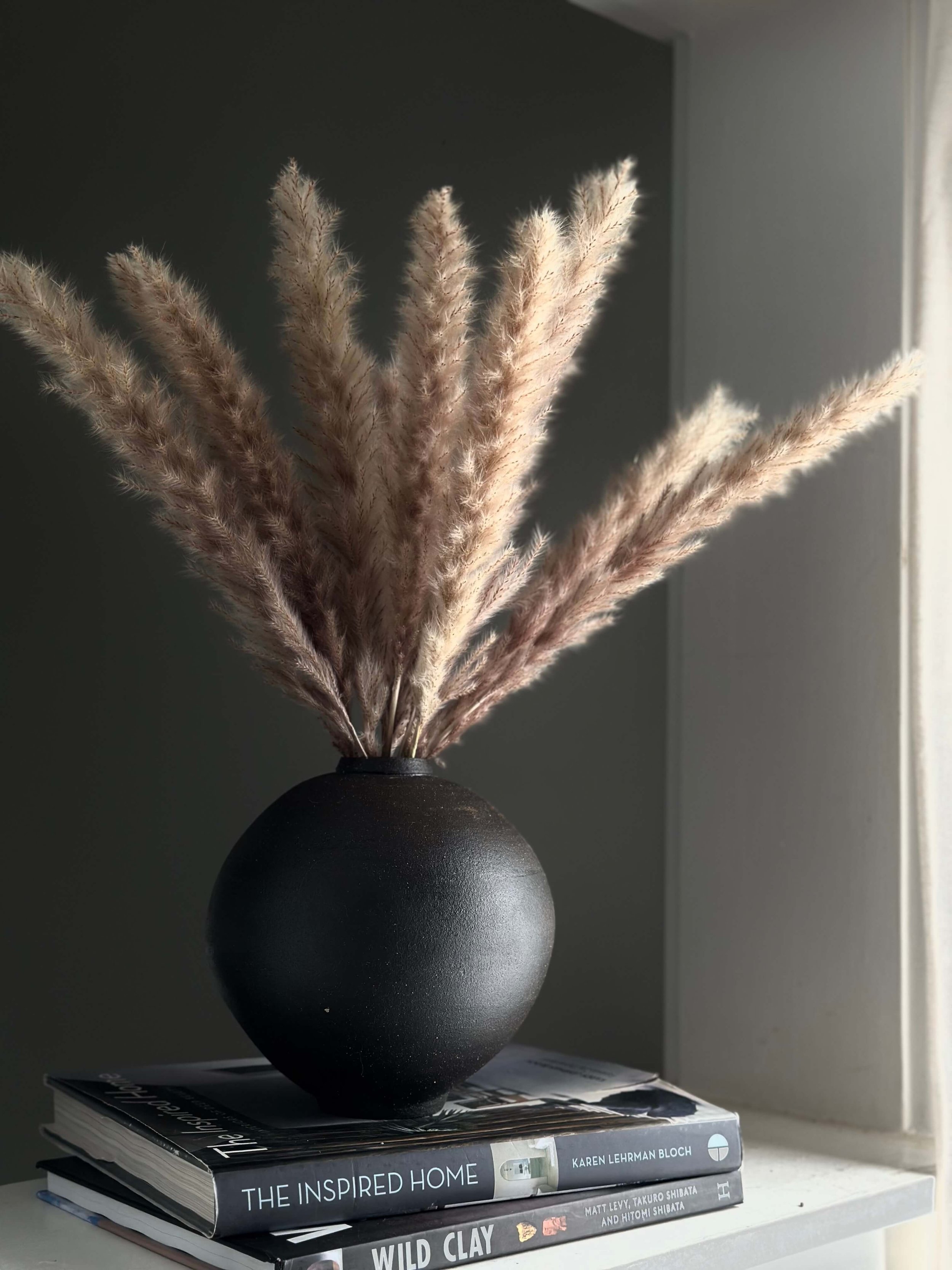 minimalist home decor, organic ceramic art, medium sculptural vessel, deep charcoal black clay, sculptural home decor, centerpiece pottery, artisanal homeware for designers
