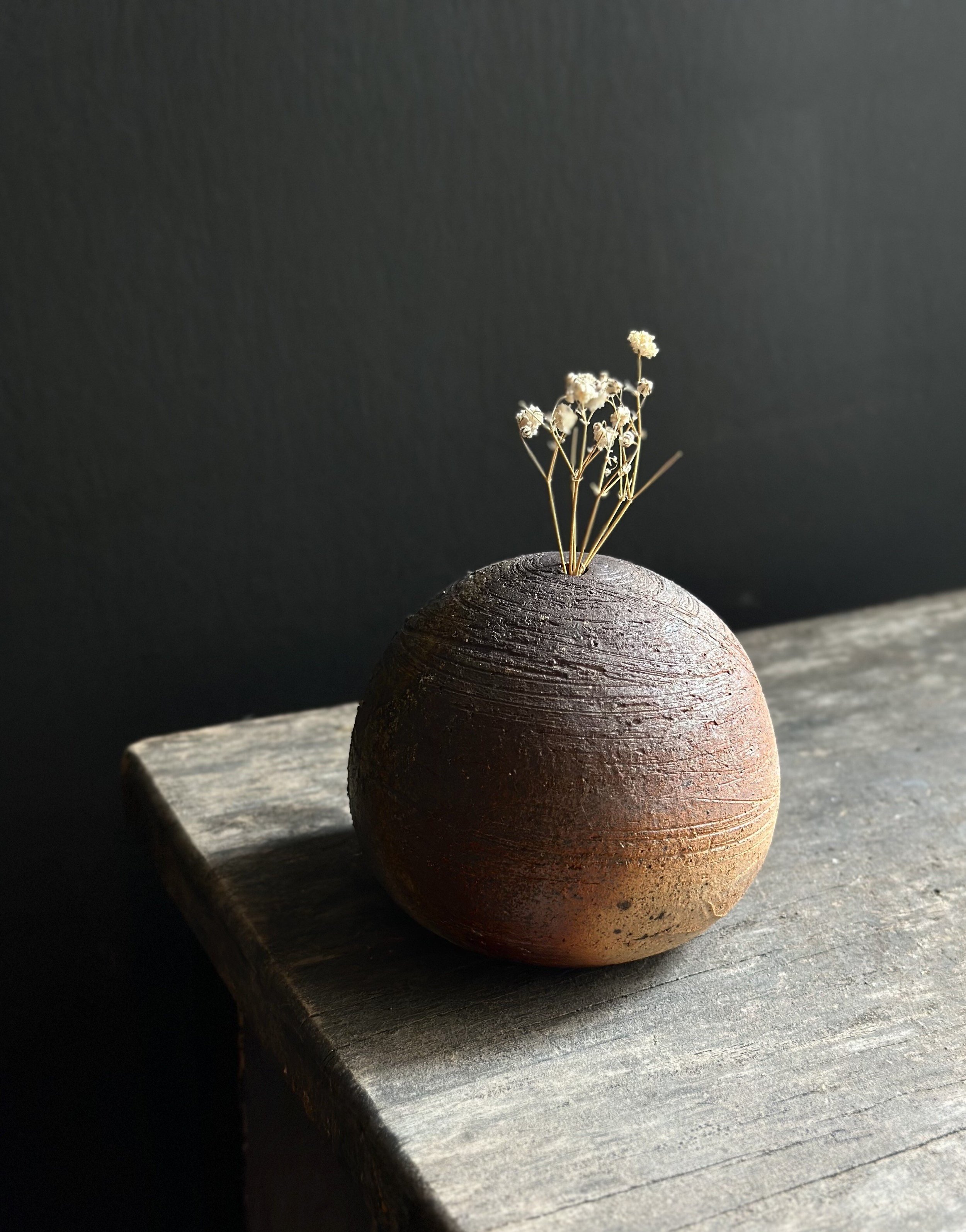 rustic modern interiors, wild clay ceramics, hand-thrown pottery, wood-fired ceramics, small bud vase, earthy ceramic vase, one-of-a-kind ceramic vase, curated minimalist home accents