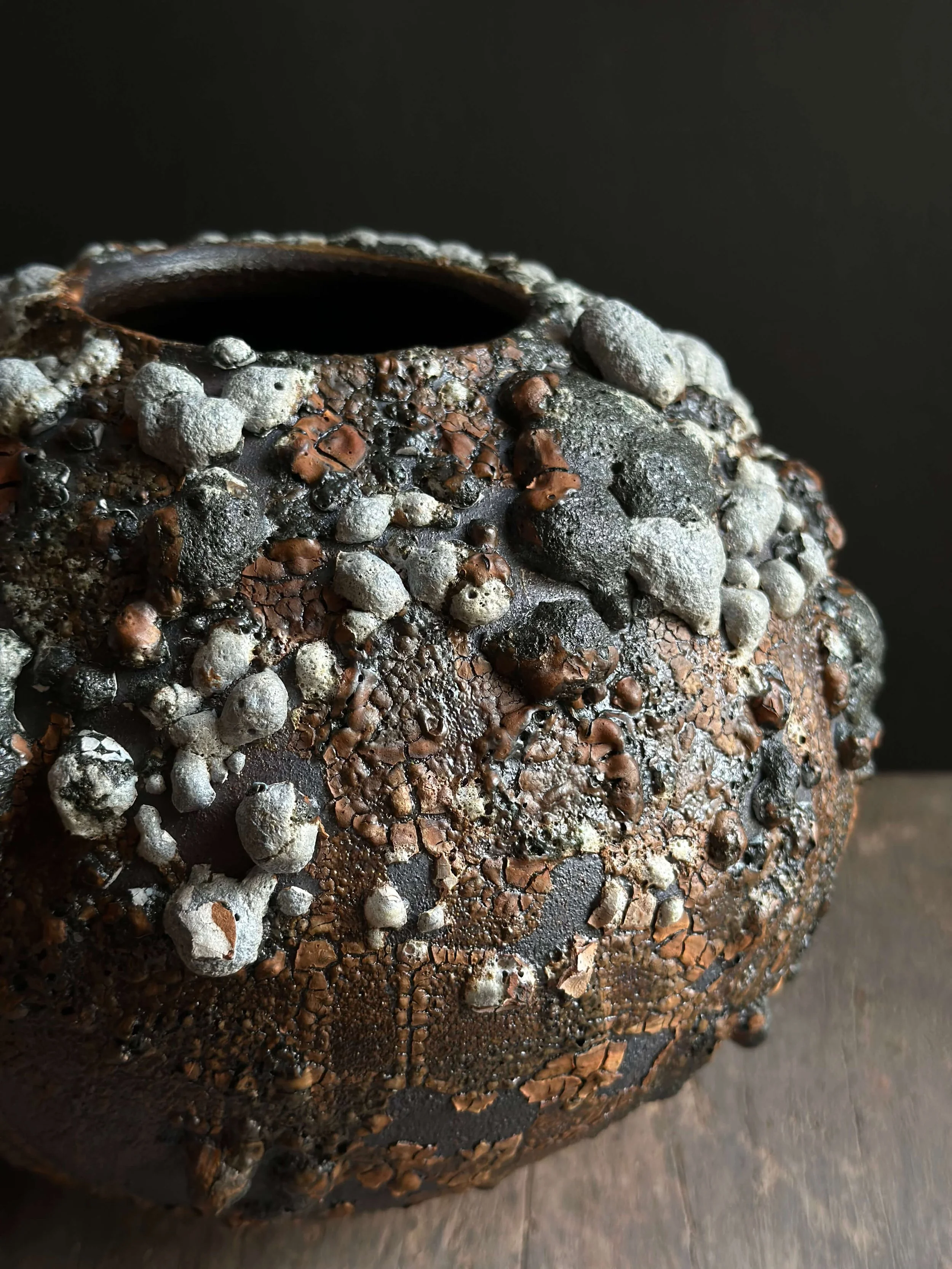 Decorative ceramic vessel with crawl glaze surface — organic pottery texture from underfired lava glaze technique