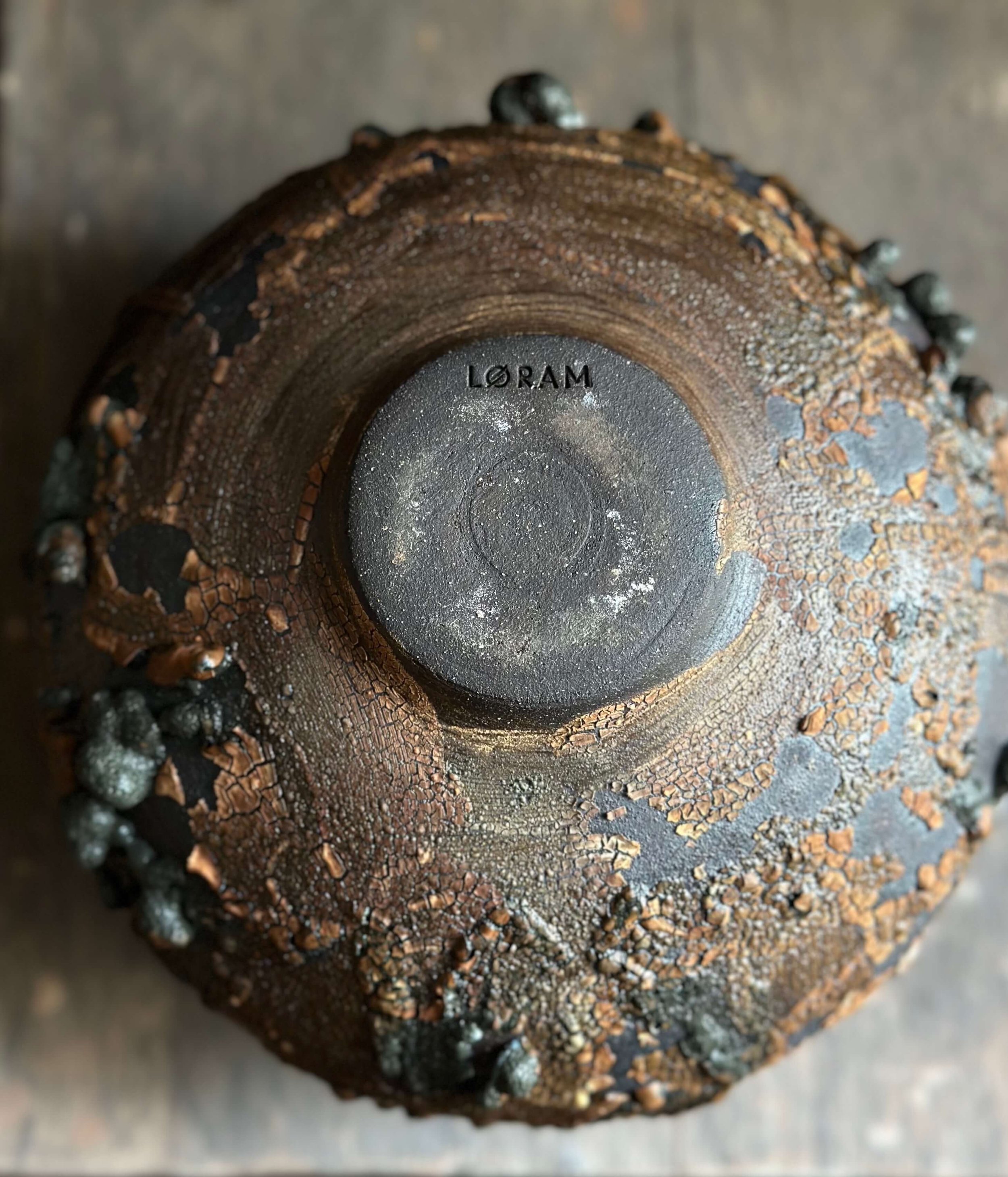rustic modern interiors, raw aesthetic decor, rough-textured ceramics, weathered textures, volcanic glaze home decor, one-of-a-kind ceramic vase, textural ceramics for interiors