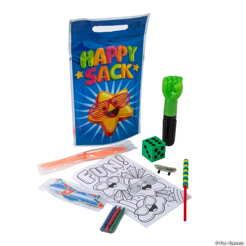 A gift bag labeled 'Happy Sack' with a star character wearing sunglasses, a green finger puppet, a green die, a skateboard keychain, a rainbow-colored candy cane, a coloring sheet, and colored chalks.