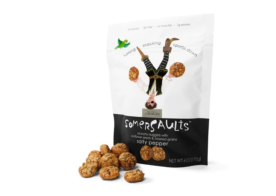 A bag of Somersaults salty pepper crunchy nuggets with sunflower seeds and toasted grains, with some nuggets placed in front of the bag.