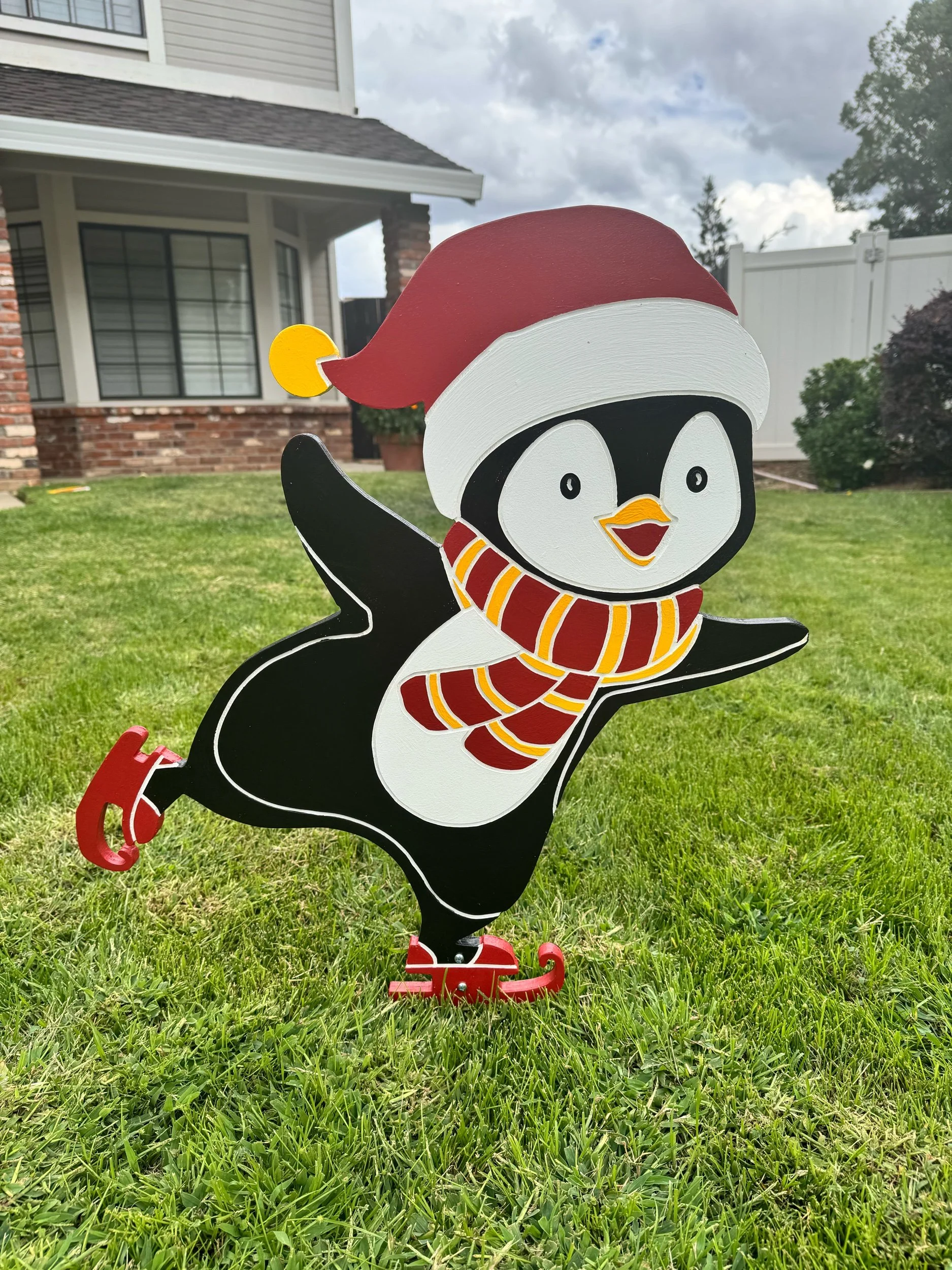 Ice Skating Penguin with Santa Hat – Holiday Yard Art Decoration