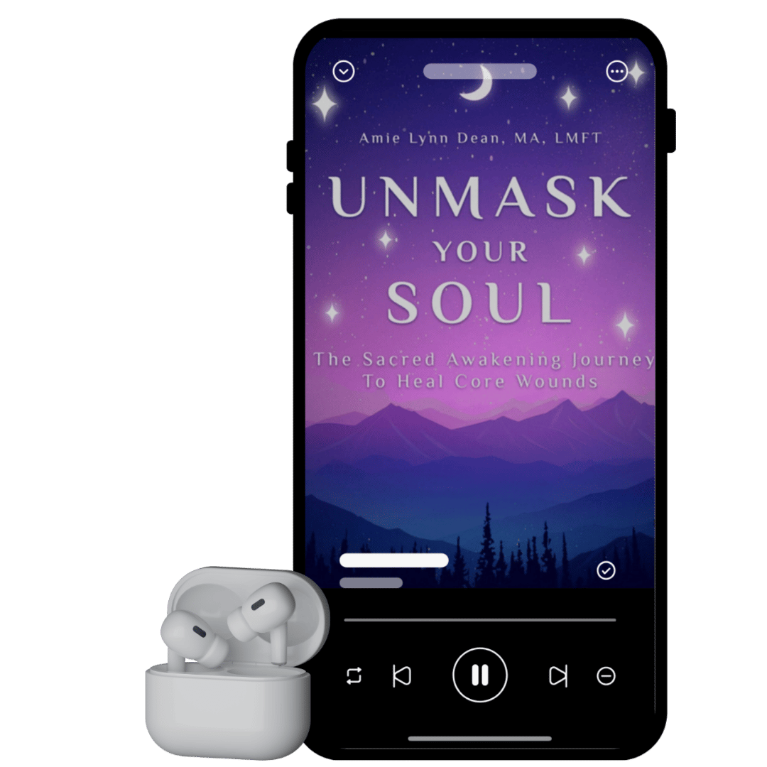 A smartphone displaying the audiobook cover 'Unmask Your Soul' by Amie Lynn Dean, with wireless earbuds placed below the phone.
