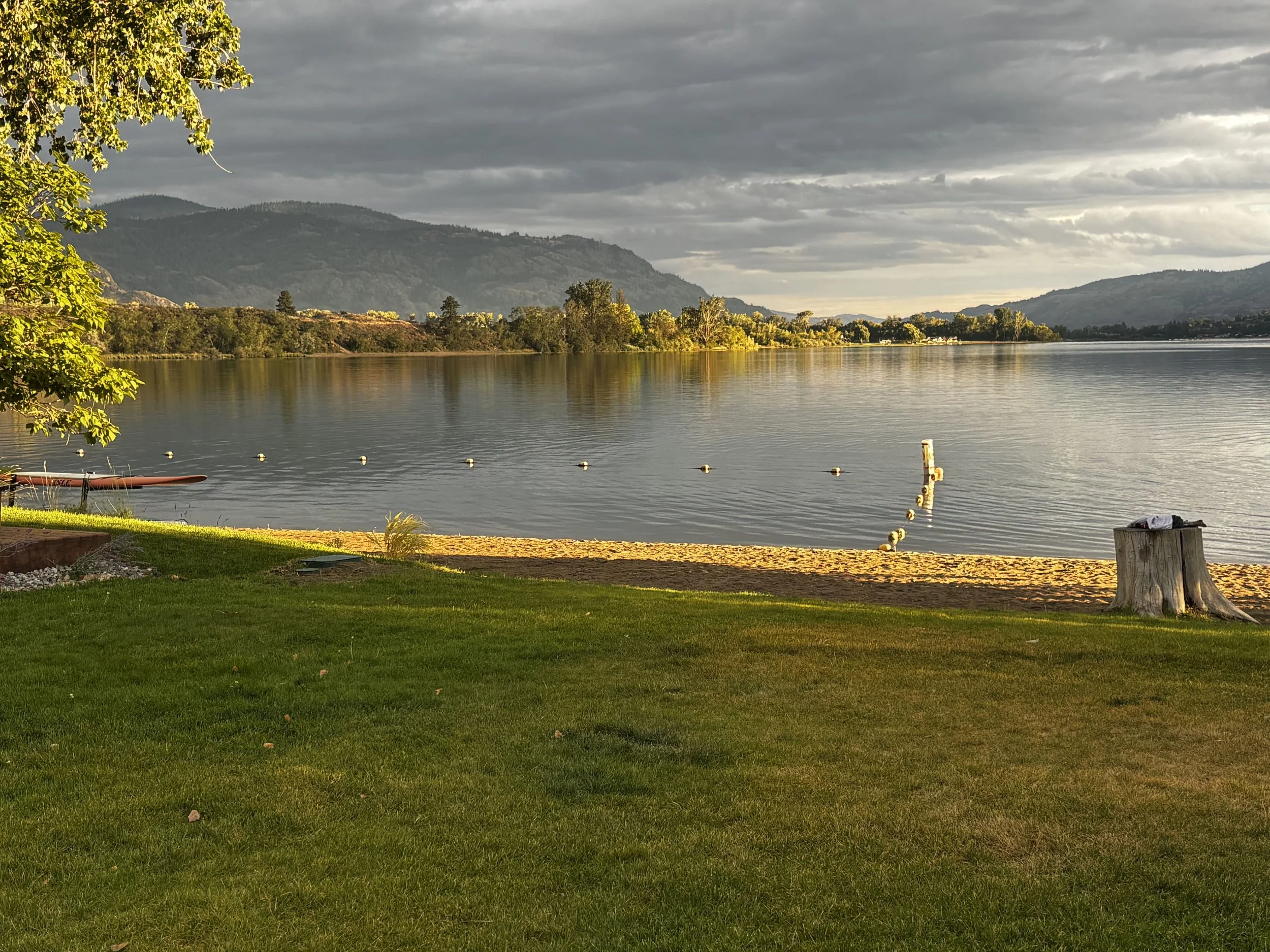 Landscape of a lake with mountains and sunset