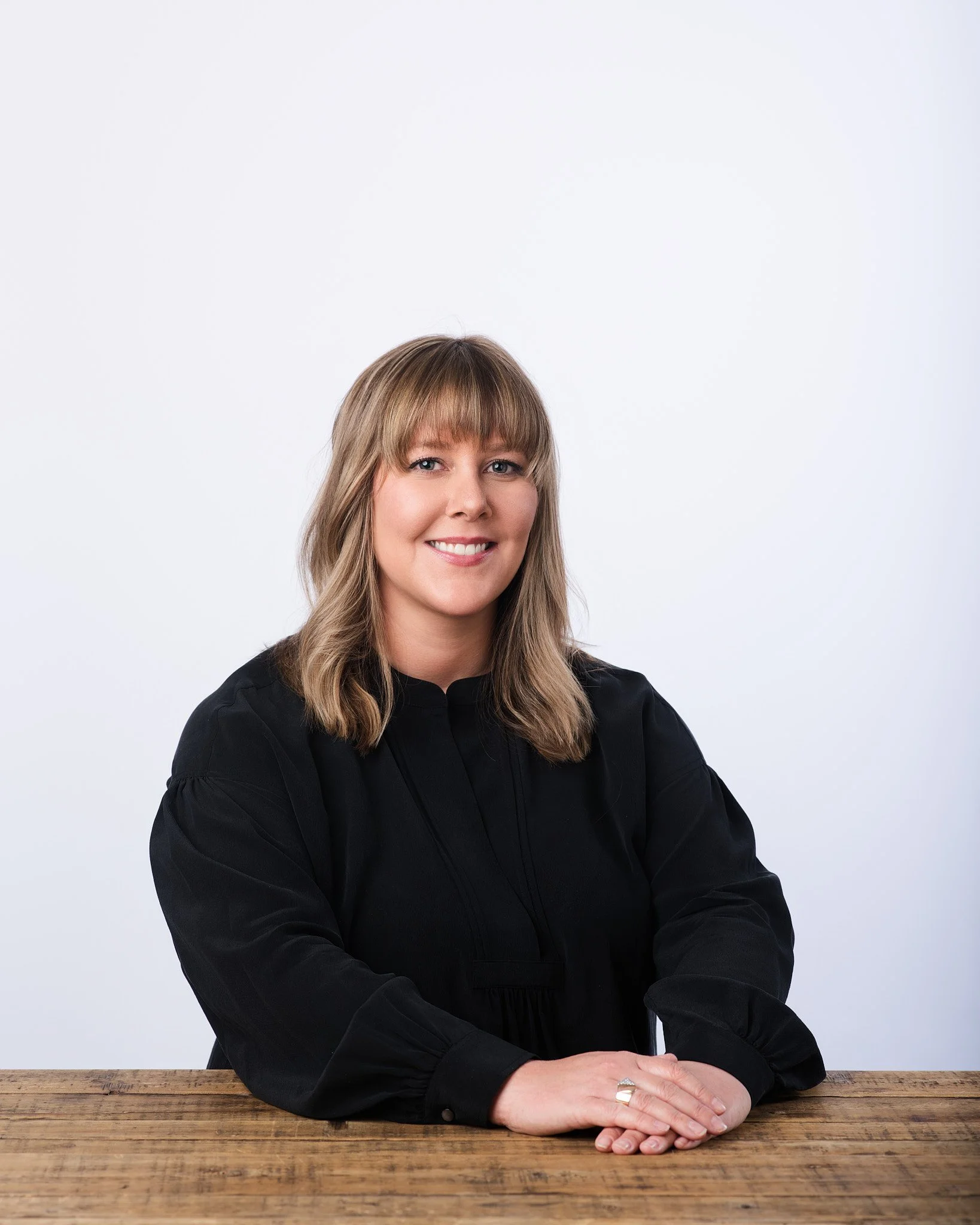 Corporate headshot photography session in NYC highlighting natural expressions and studio lighting.