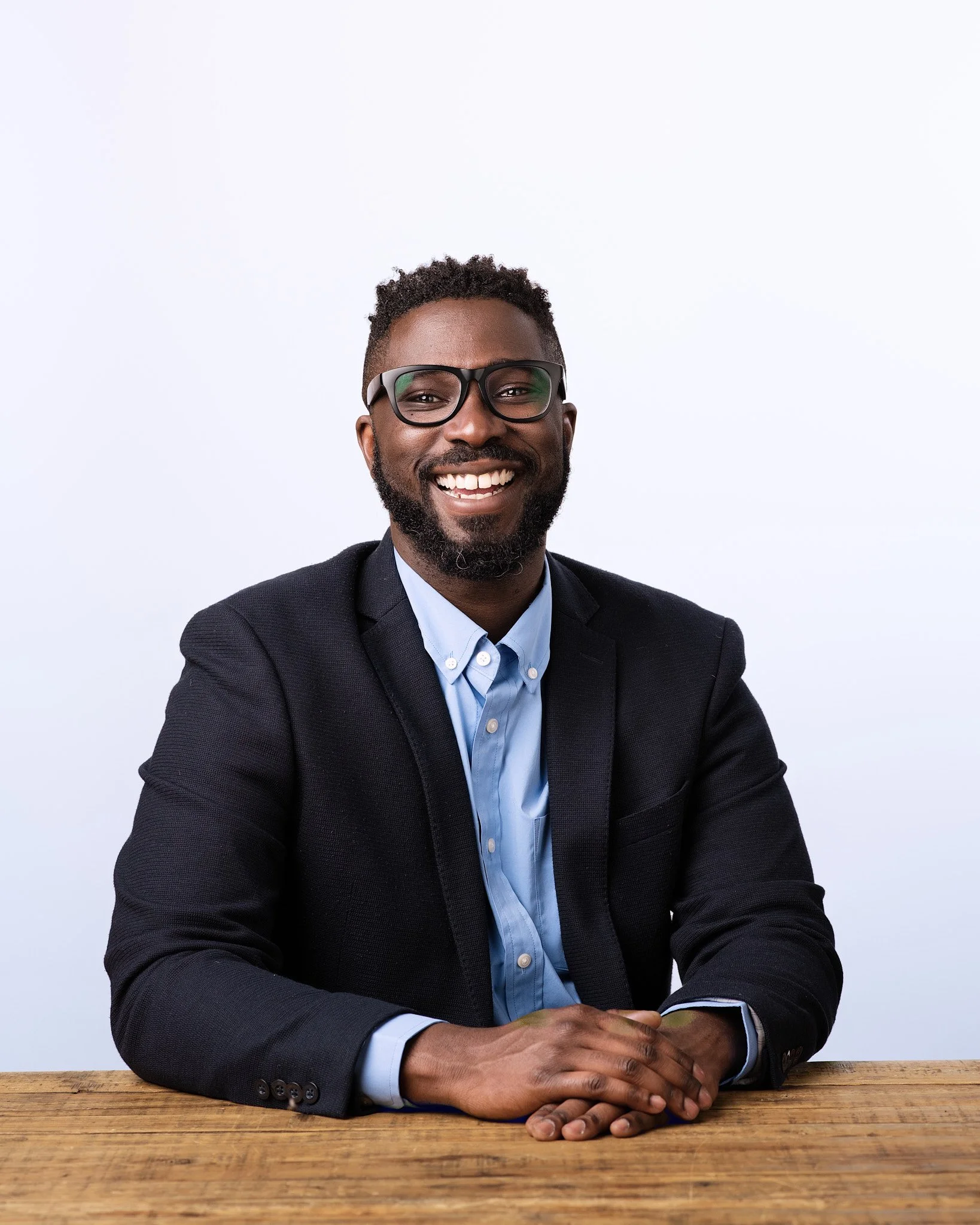 NYC corporate photographer producing modern professional headshots during a company-wide session.