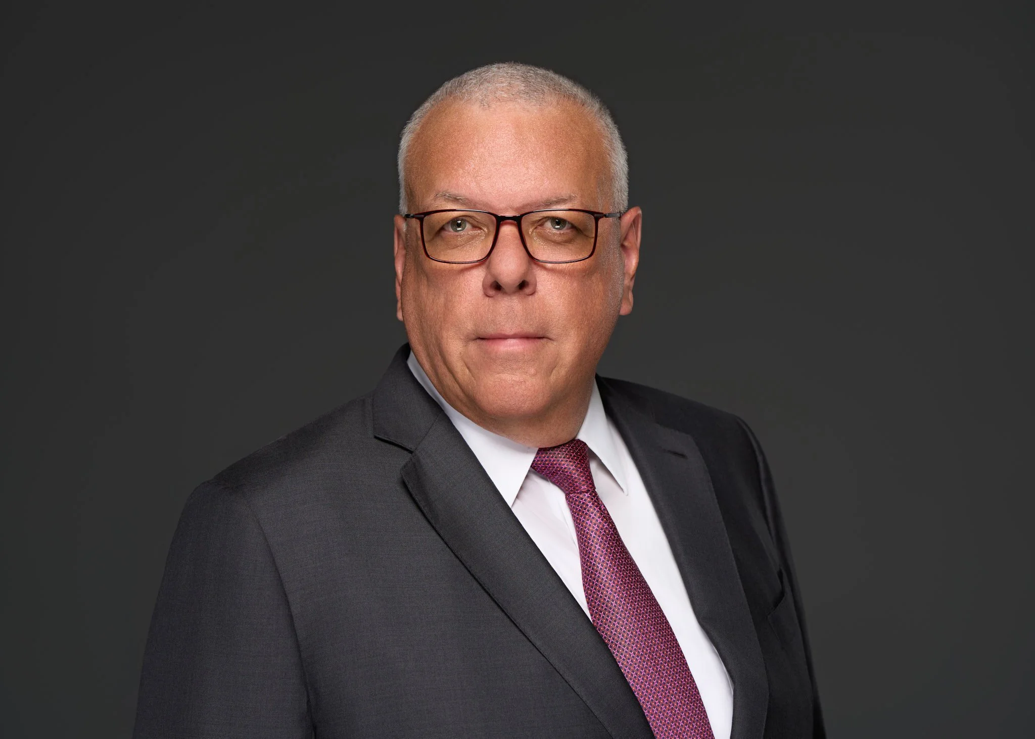 corporate_executive_headshot_gray_background_serious_nyc_david_pexton_photography.jpg