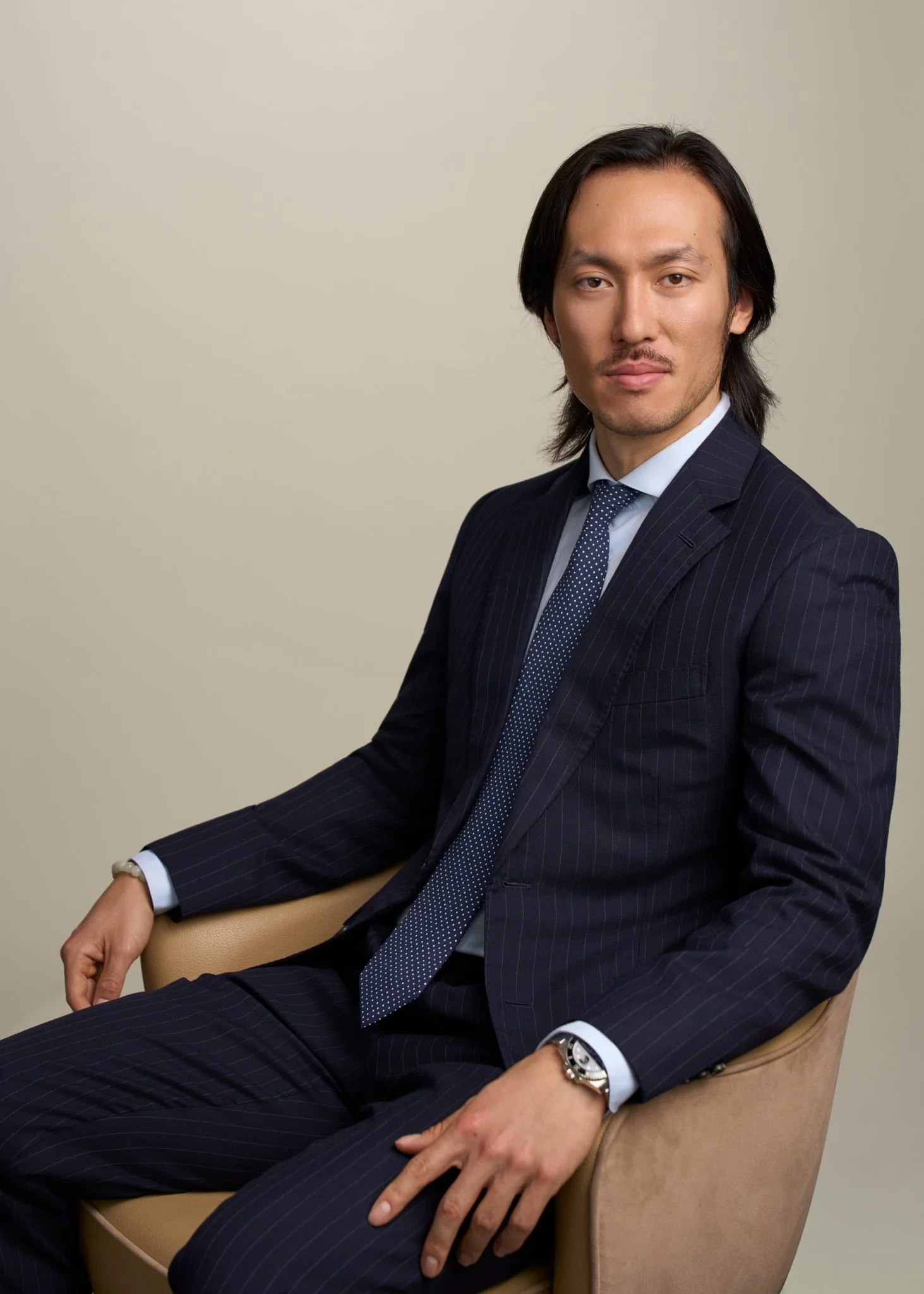 corporate_executive_headshot_navy_suit_seated_nyc_david_pexton_photography.jpg