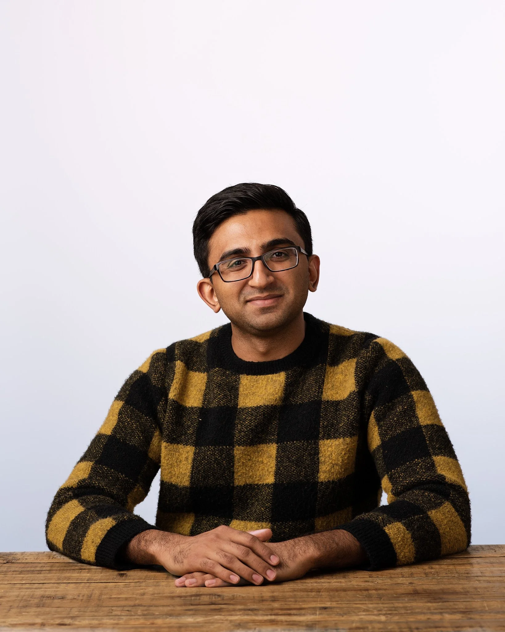 Professional headshot photographed in New York City by corporate photographer David Pexton, featuring clean lighting and a confident, approachable pose.