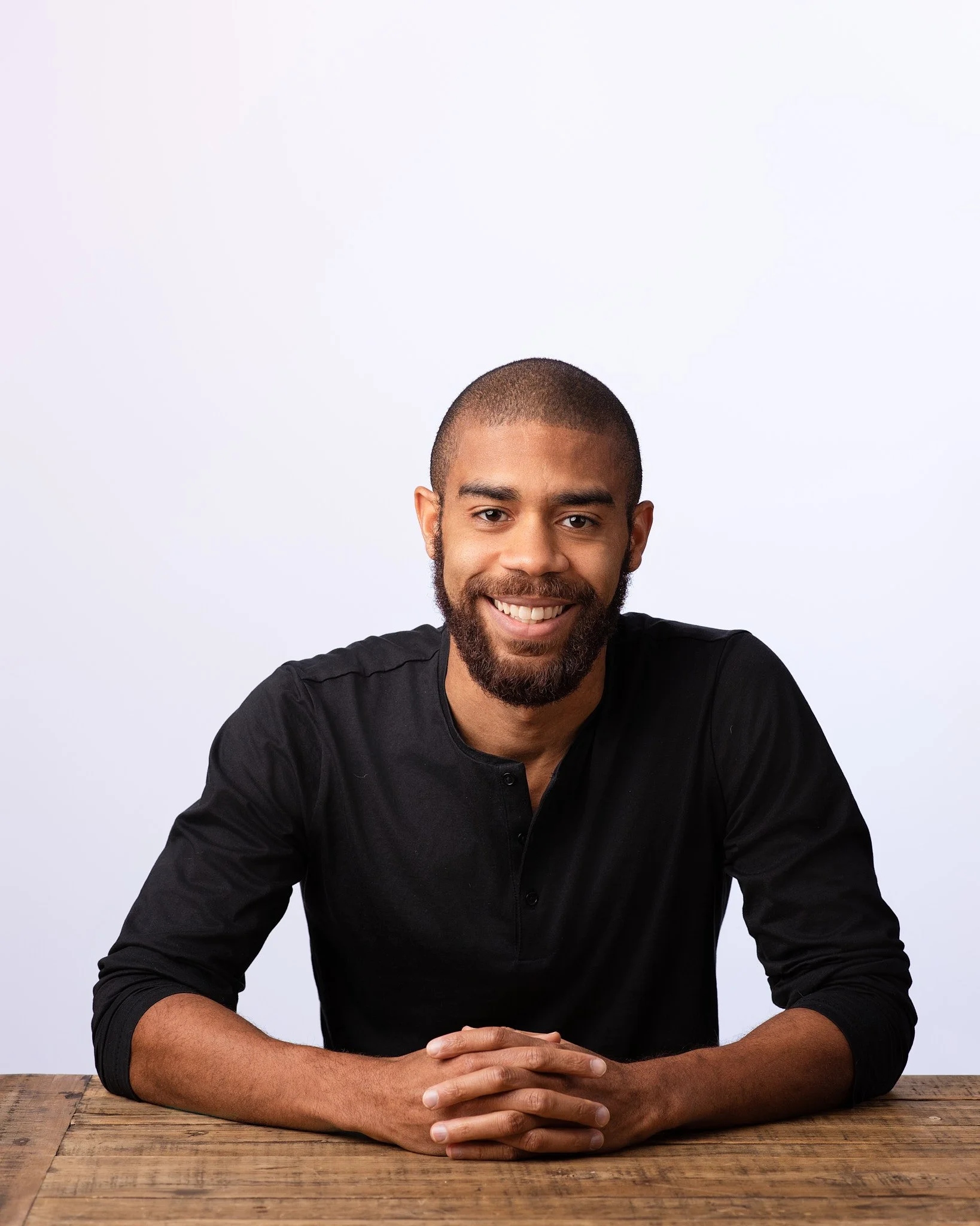 Executive business headshot captured in New York City with soft lighting and neutral background