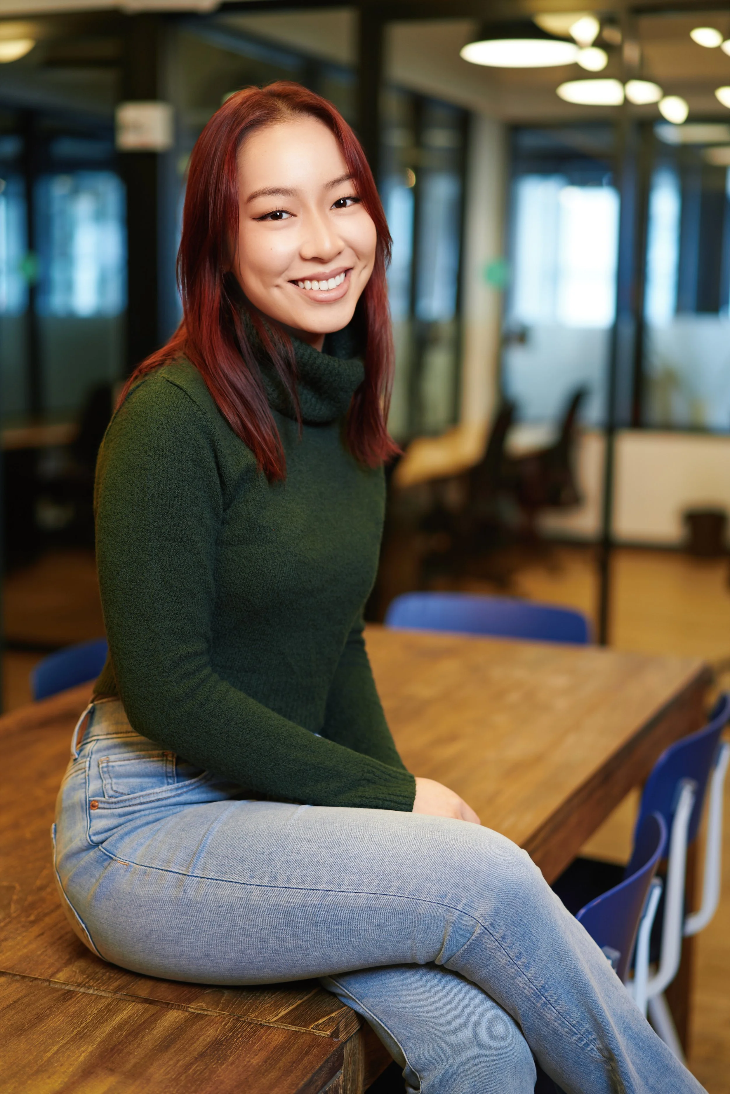 Modern workplace portrait of a woman photographed in a New York City office environment