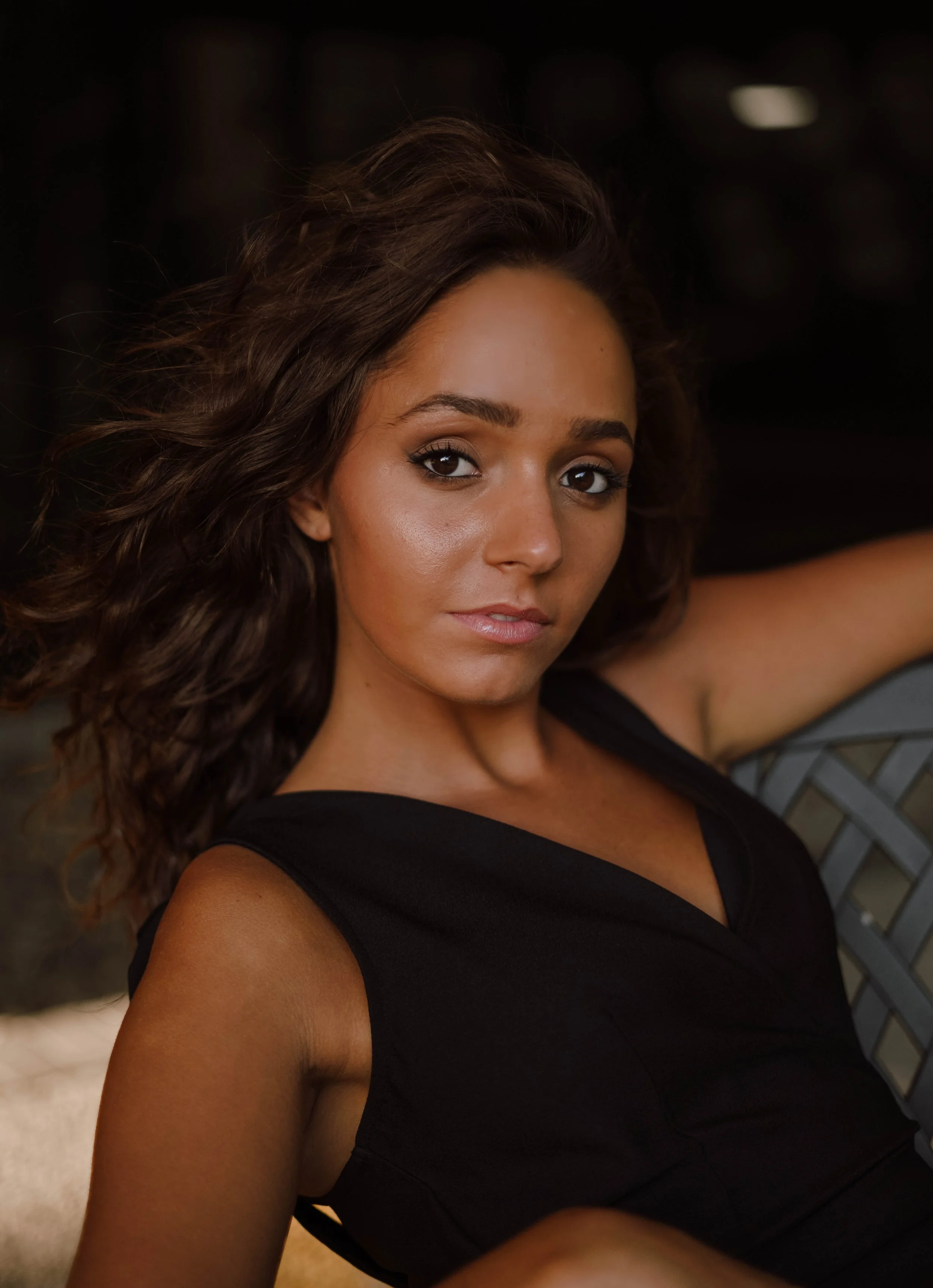 Laurie’s customers, Mariana and Carmen holding hands on a green lawn on their wedding day.