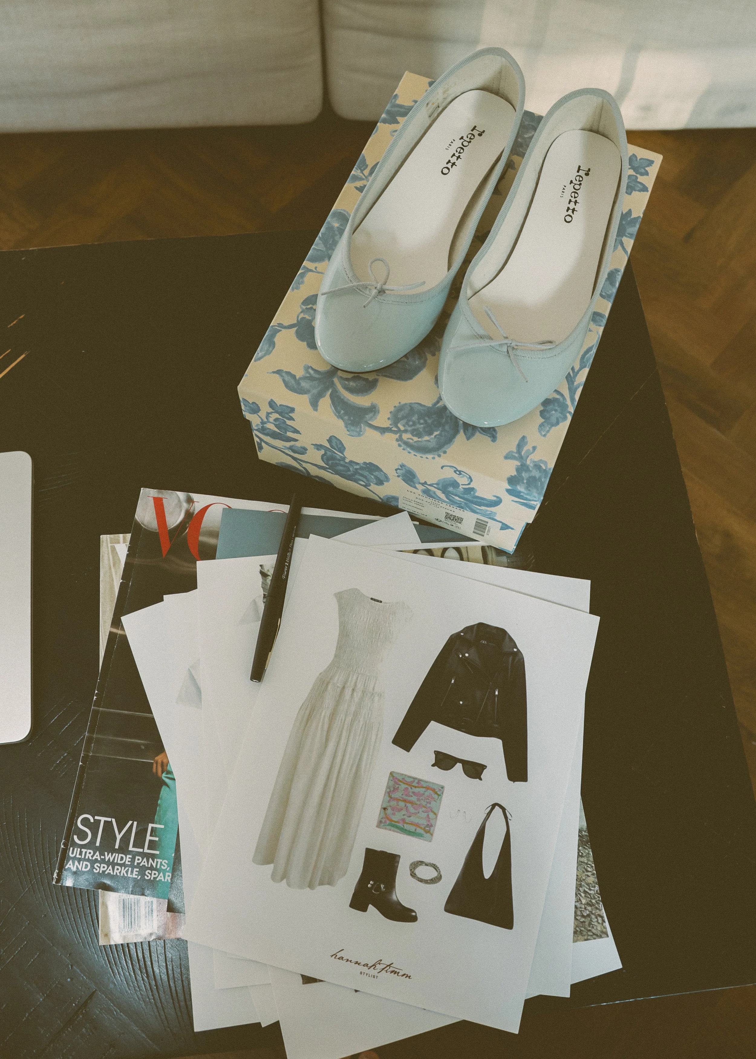 blue patent leather heels and flat lay photos of leather jacket and feminine dress and moto boots